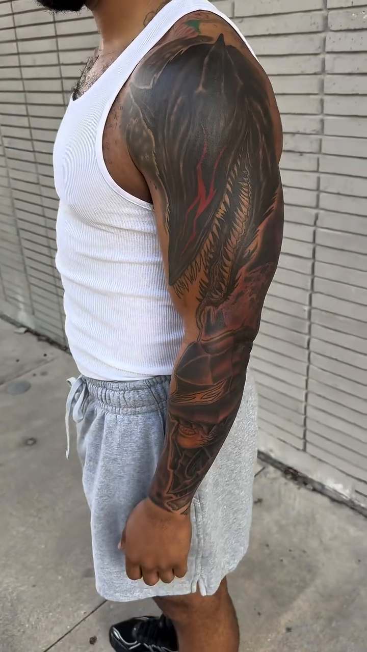 Dragon sleeve tattoo realism tattoo on the upper arm by Michael Bogle