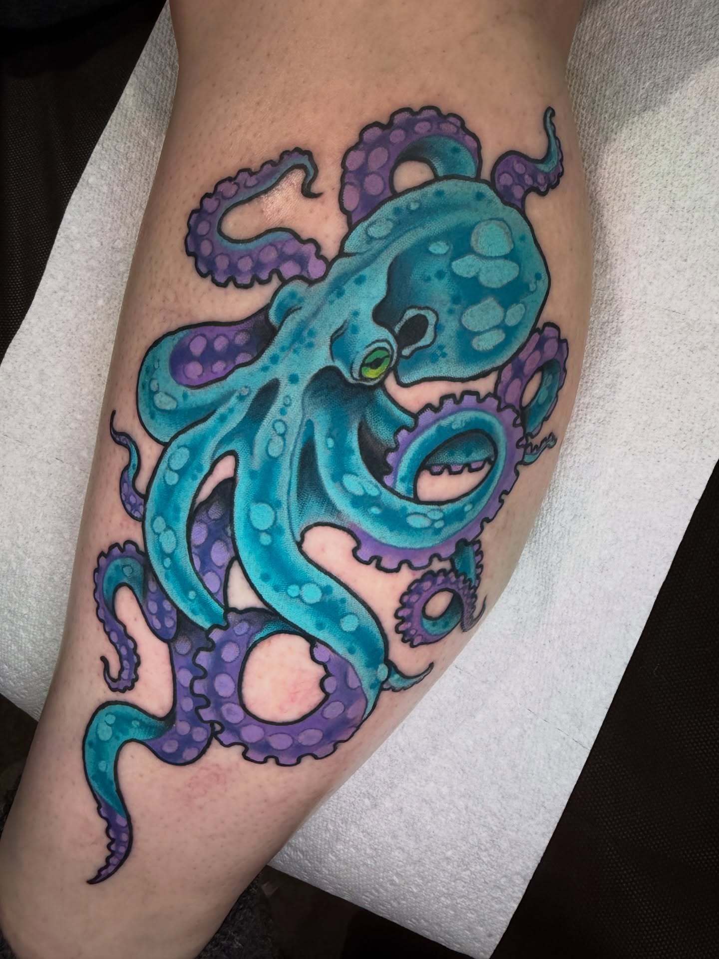 Octopus realism tattoo on the forearm by James Mullin