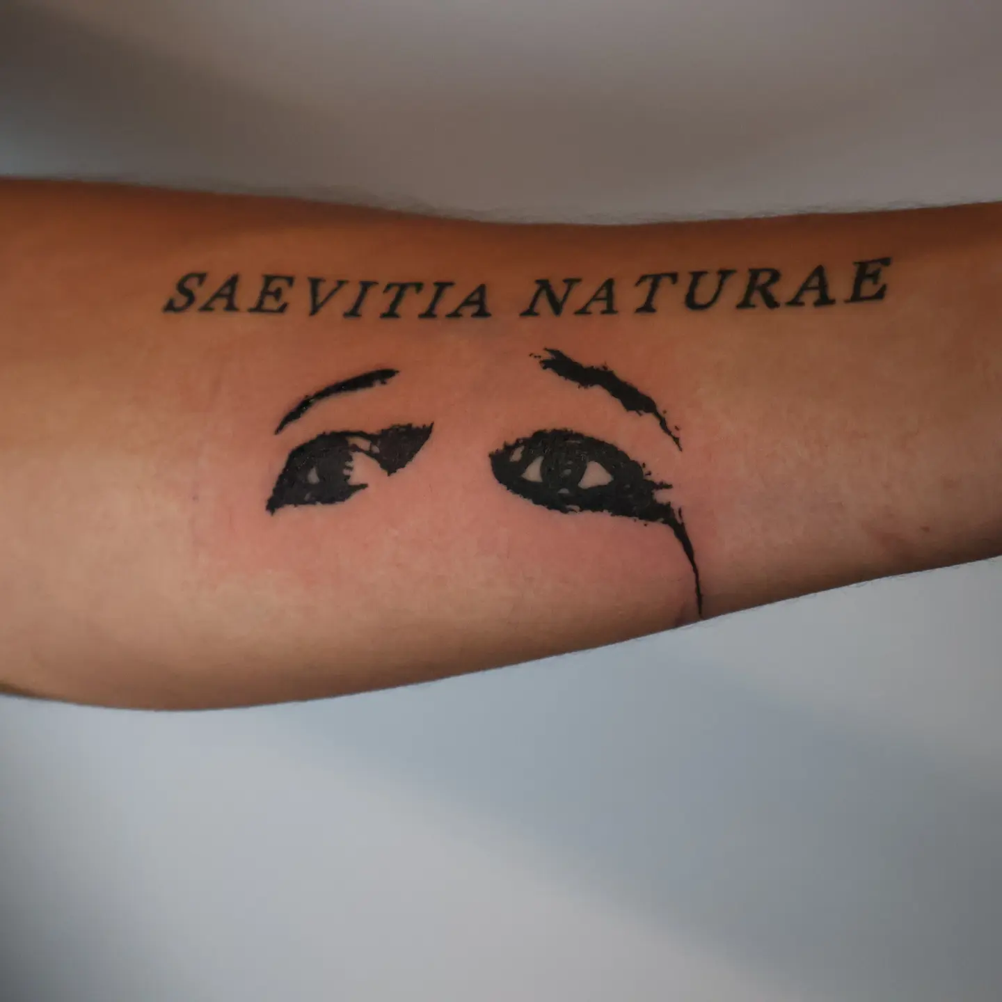 Eyes black and grey tattoo on the forearm by Joc
