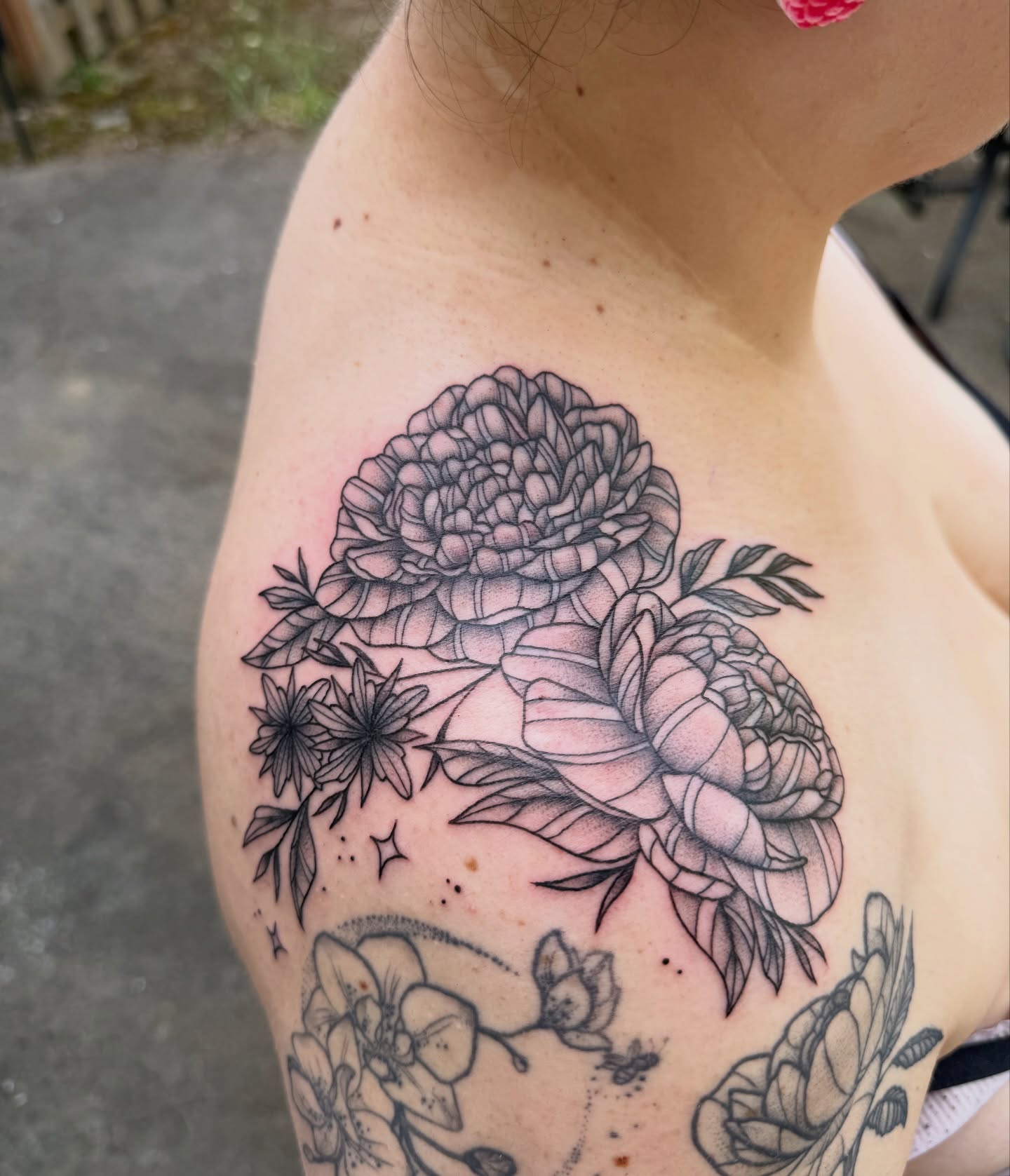 Floral bouquet realism tattoo on the shoulder by Jenna Nicole