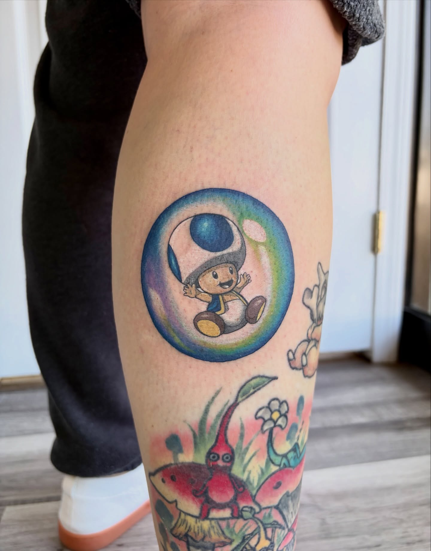 Toad in a bubble new school tattoo on the leg by Taylor Heidtbrink
