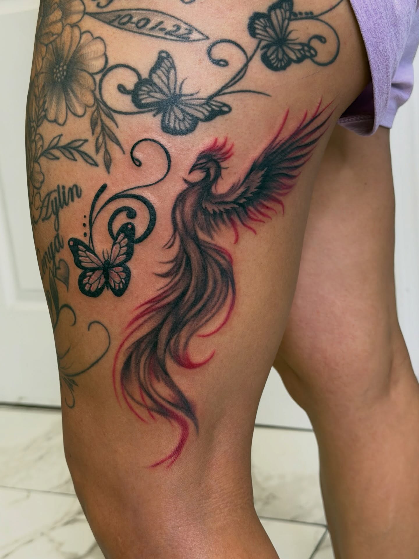 Phoenix new school tattoo on the thigh by linda perez