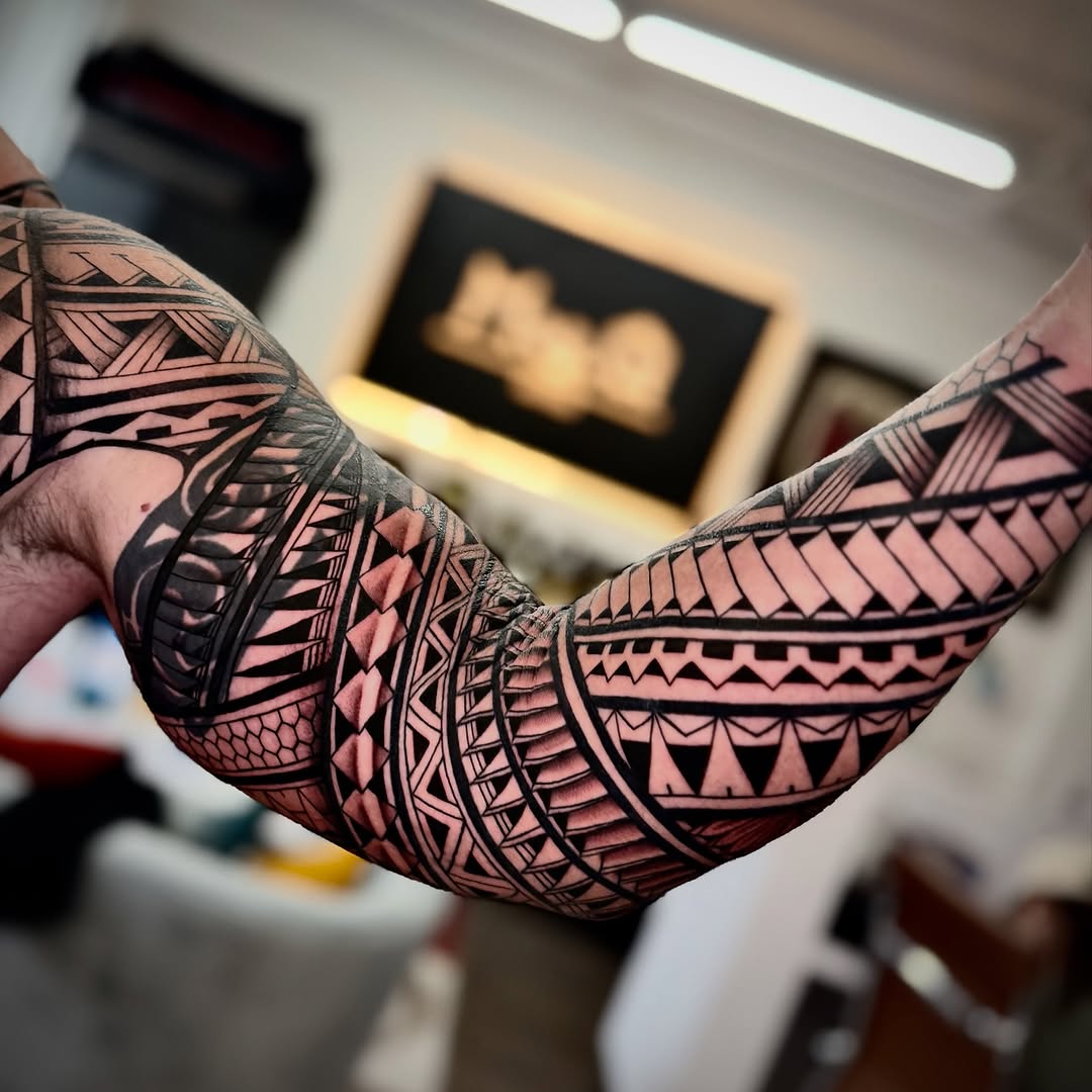 Geometric tribal patterns tribal tattoo on the forearm by Ivy lee