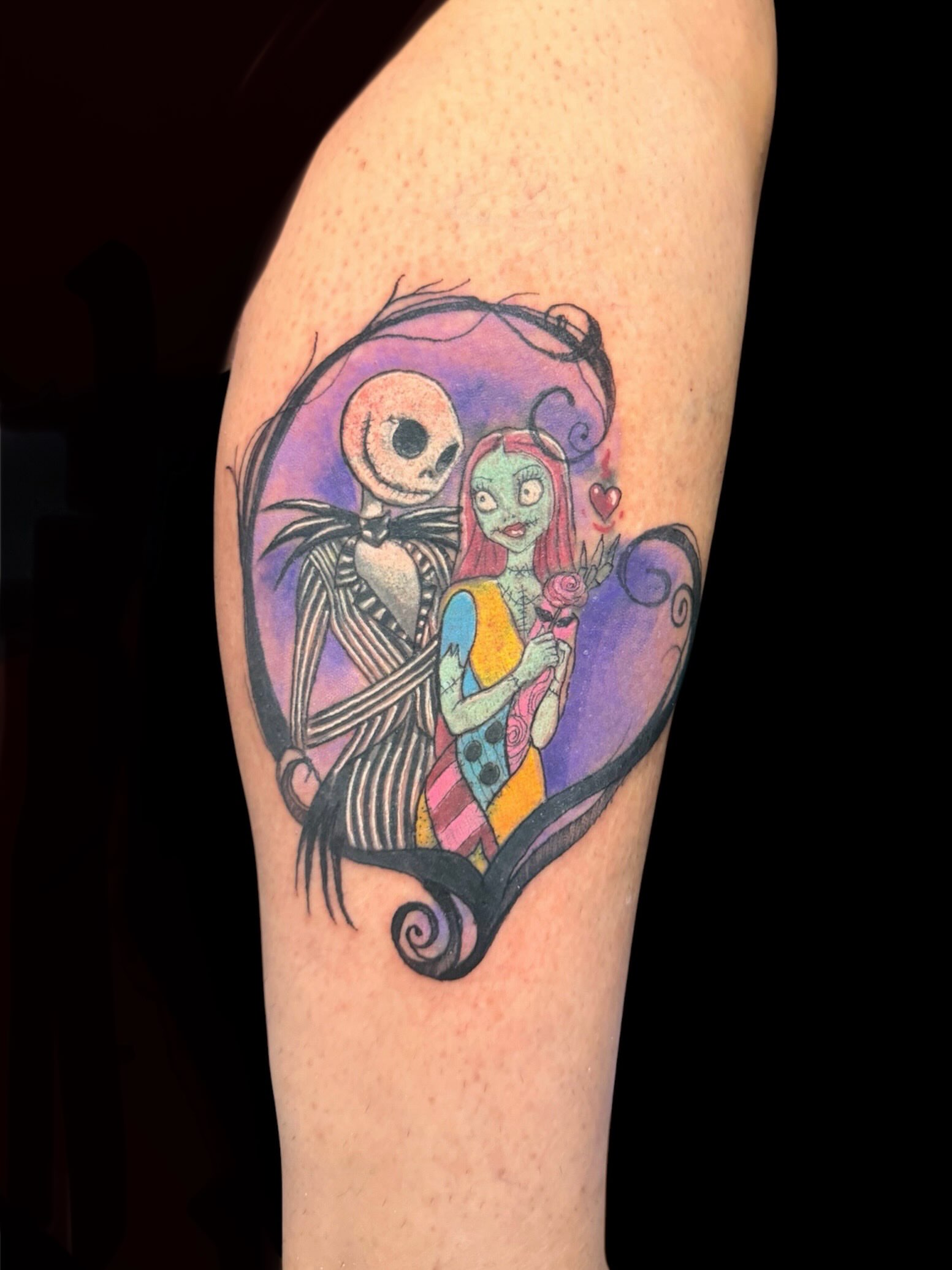Jack and Sally dark realism tattoo on the forearm by Gabrielle Frelak, York, Pennsylvania