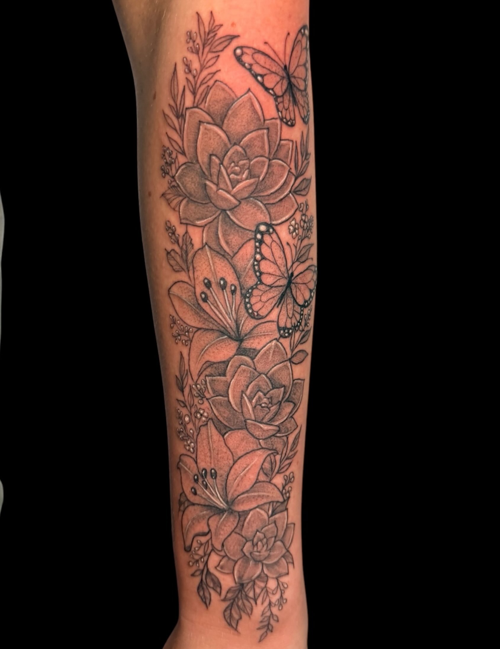 Floral arrangement realism tattoo on the forearm by Gabrielle Frelak, York, Pennsylvania