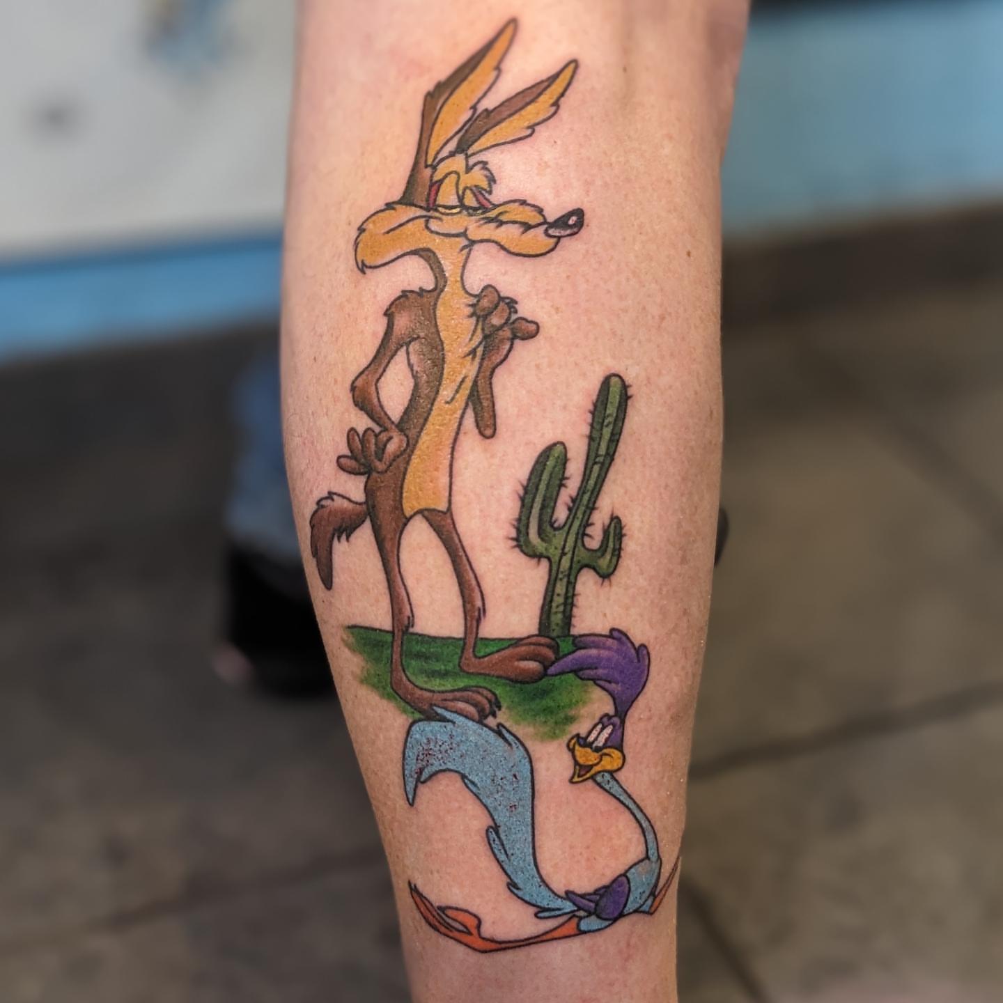 Road runner and coyote new school tattoo on the forearm by Matt Simmonds