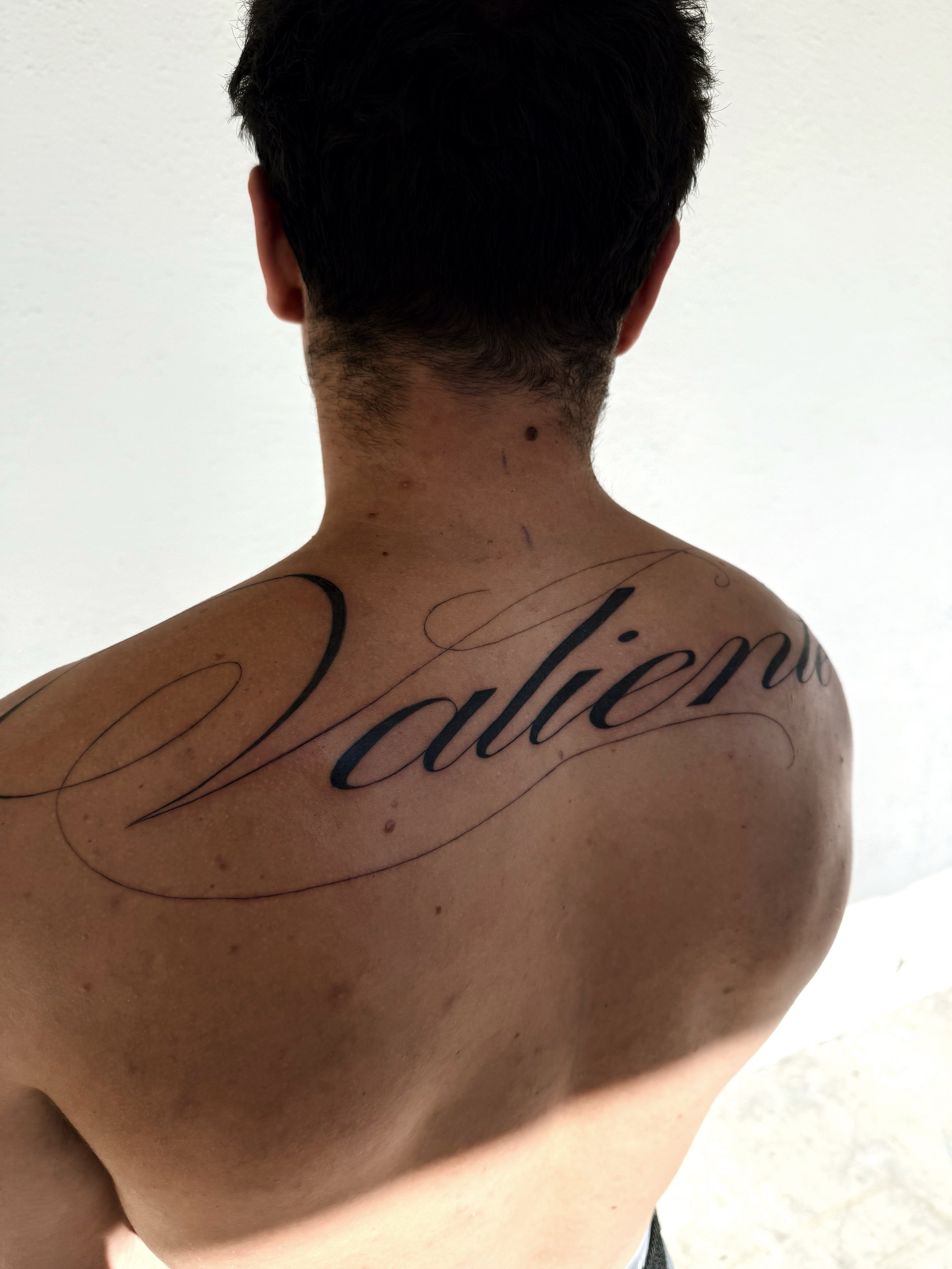 Script lettering lettering script tattoo on the shoulder by viktoria raquel