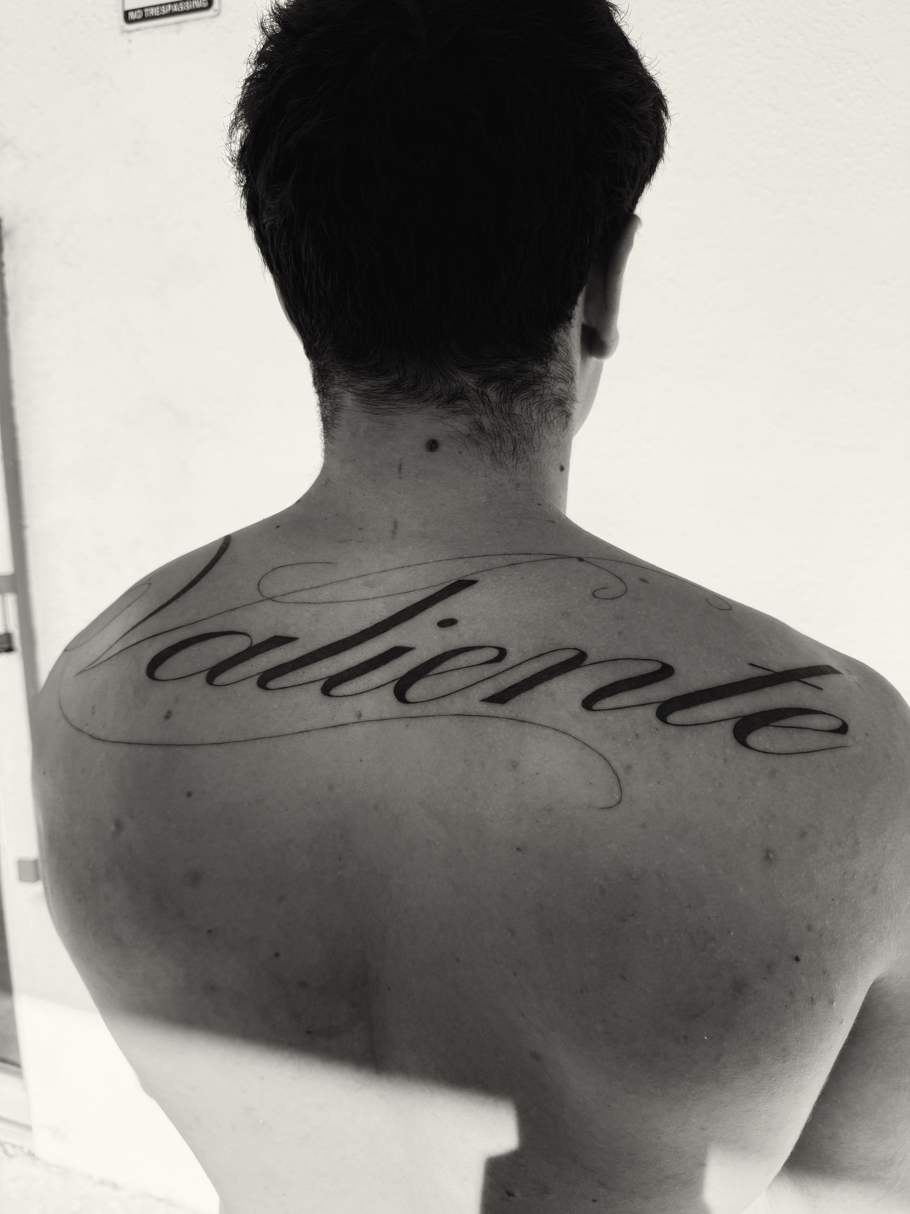 Script lettering lettering script tattoo on the back by viktoria raquel