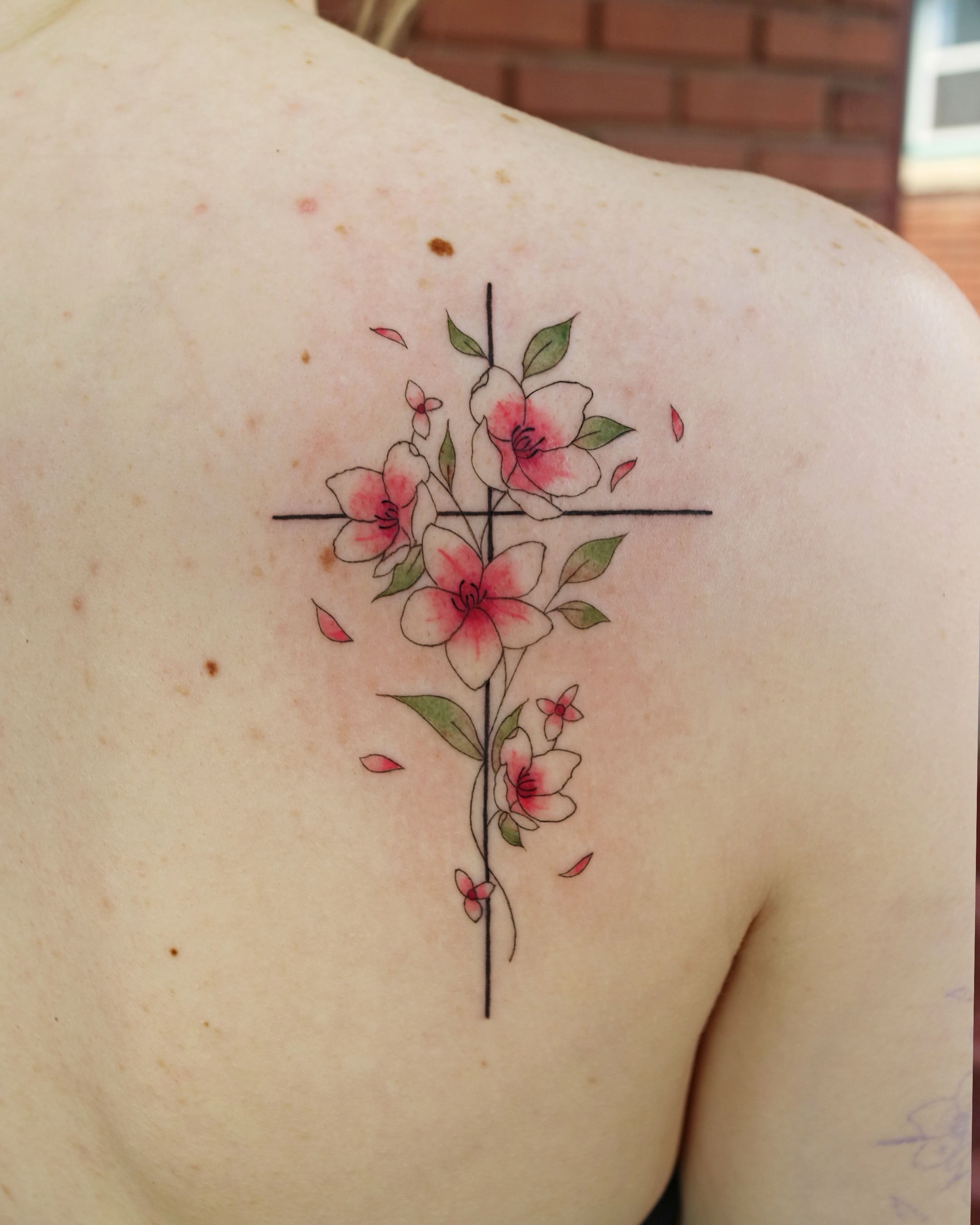 Flowers new school tattoo on the shoulder by Aroha