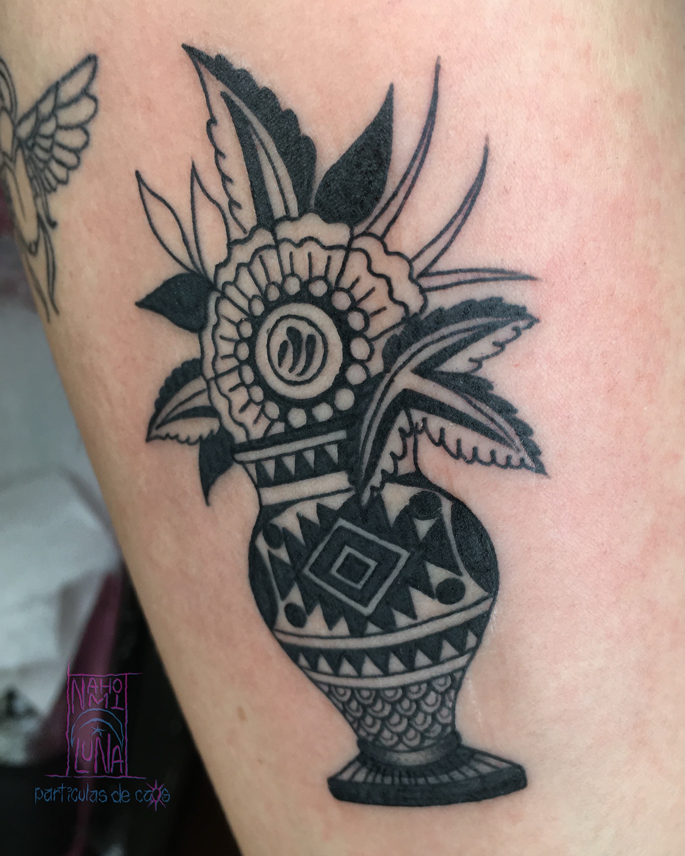 Vase with flowers black and grey tattoo on the thigh by Nahomi Luna - Memphis & Cordova Tattoo, Memphis, Tennessee