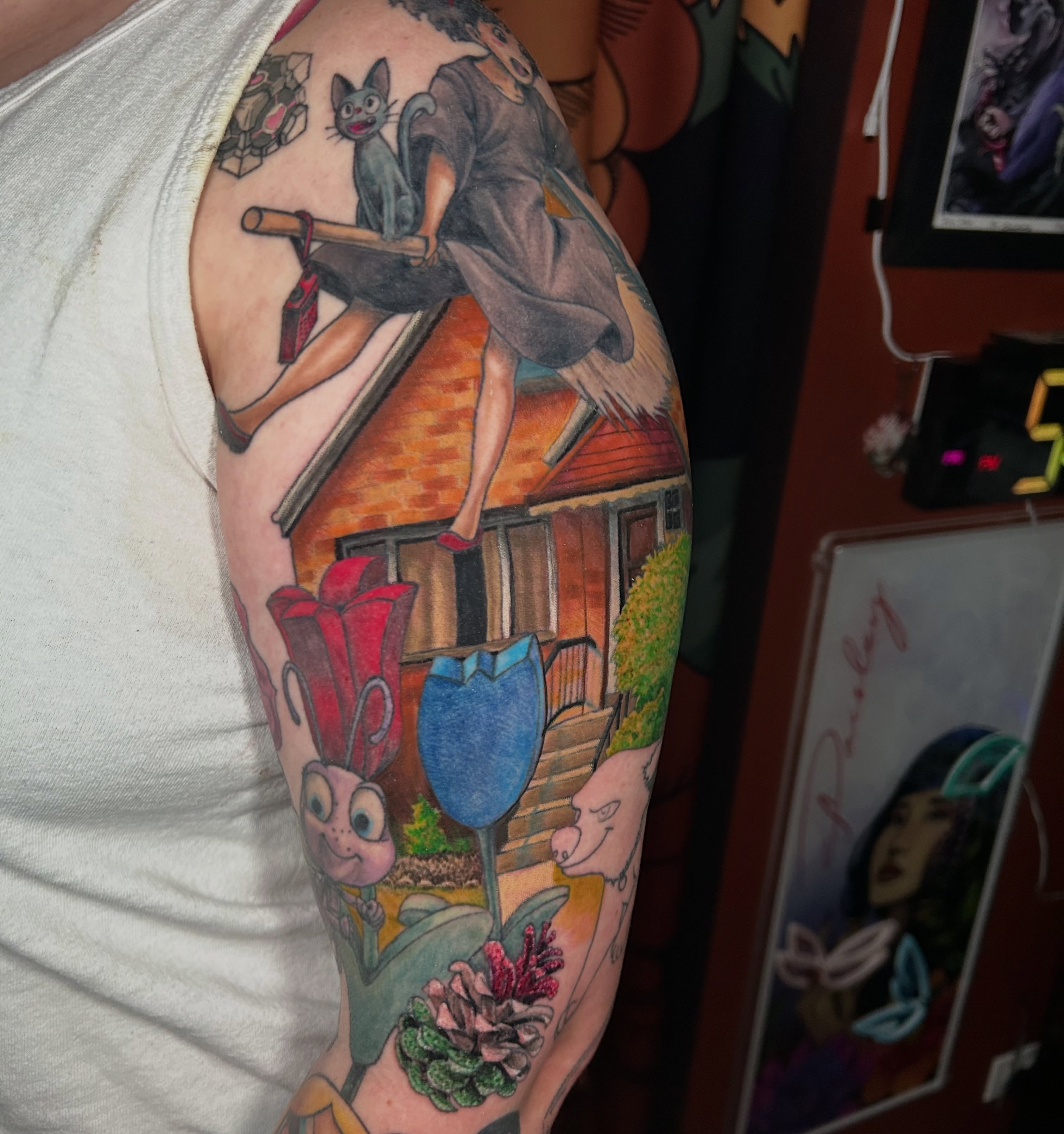 House and cat realism tattoo on the upper arm by Paisley Diaz, Lombard, Illinois
