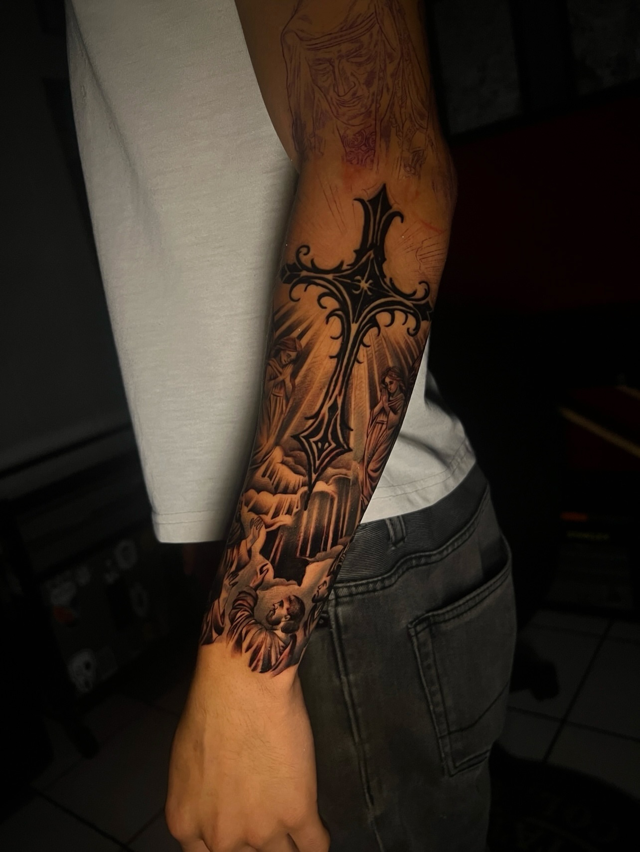 Religious scene realism tattoo on the forearm by El Salvador Tattoo Artist