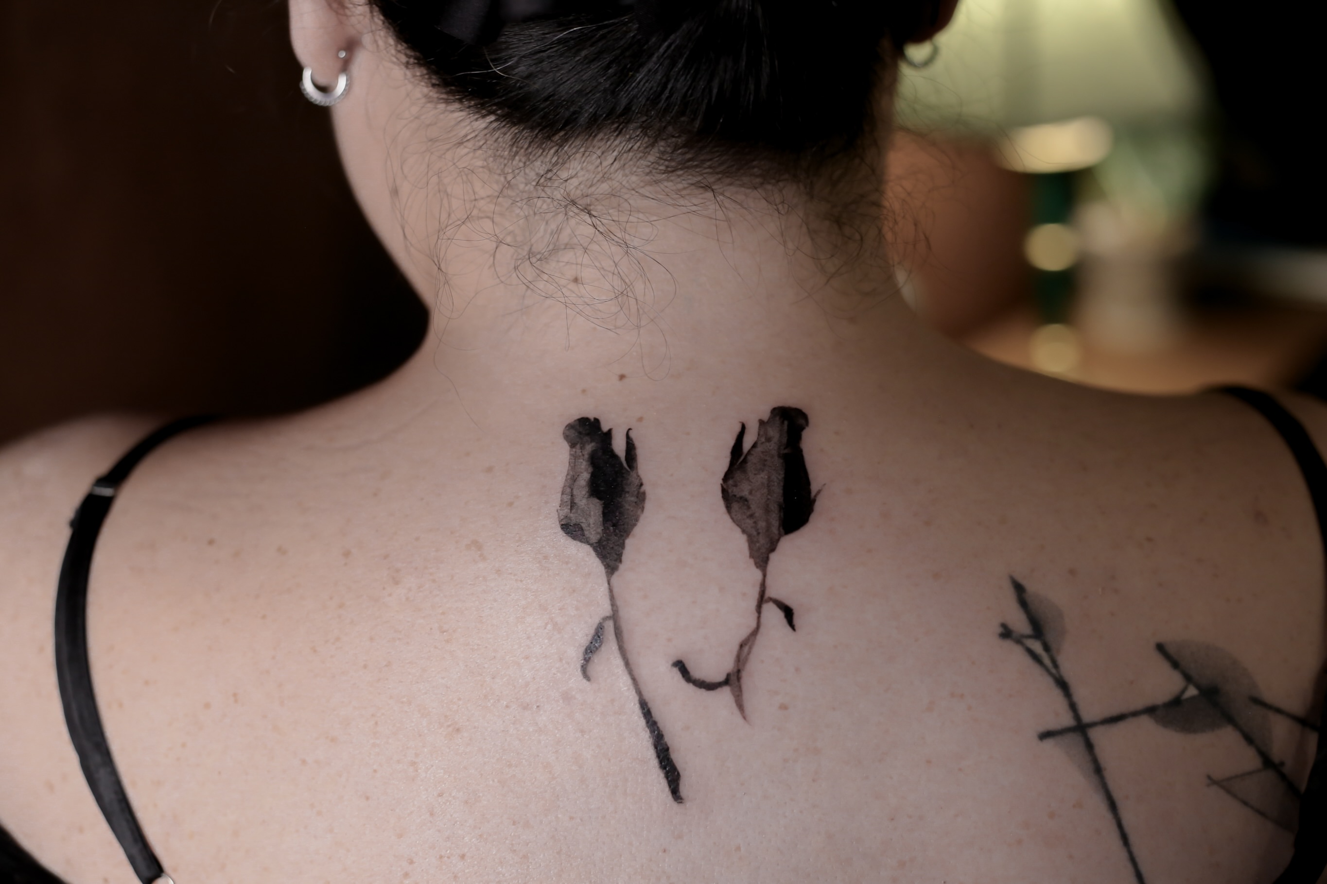 Dried roses black and grey tattoo on the back by Blight