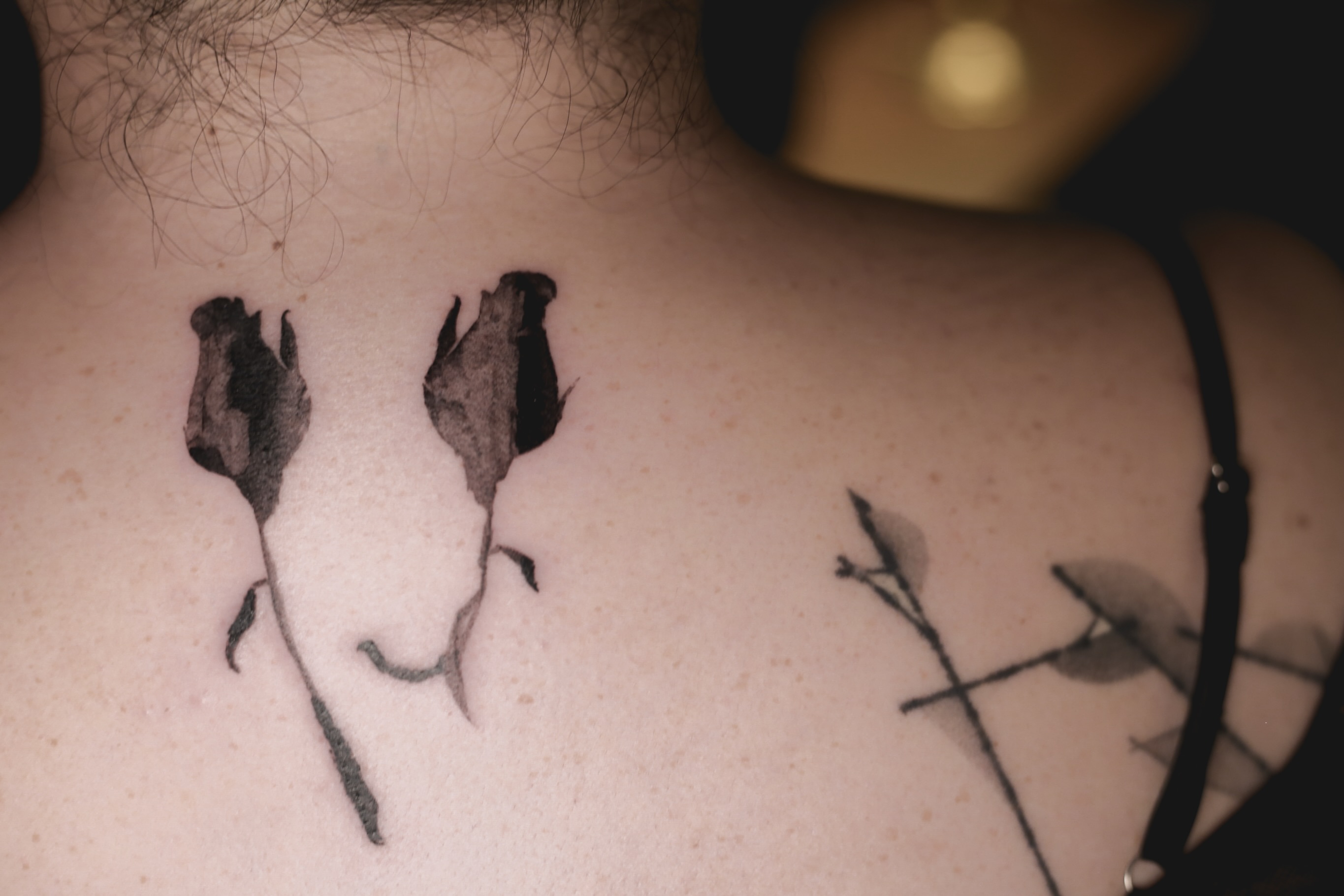 Dried roses black and grey tattoo on the chest by Blight
