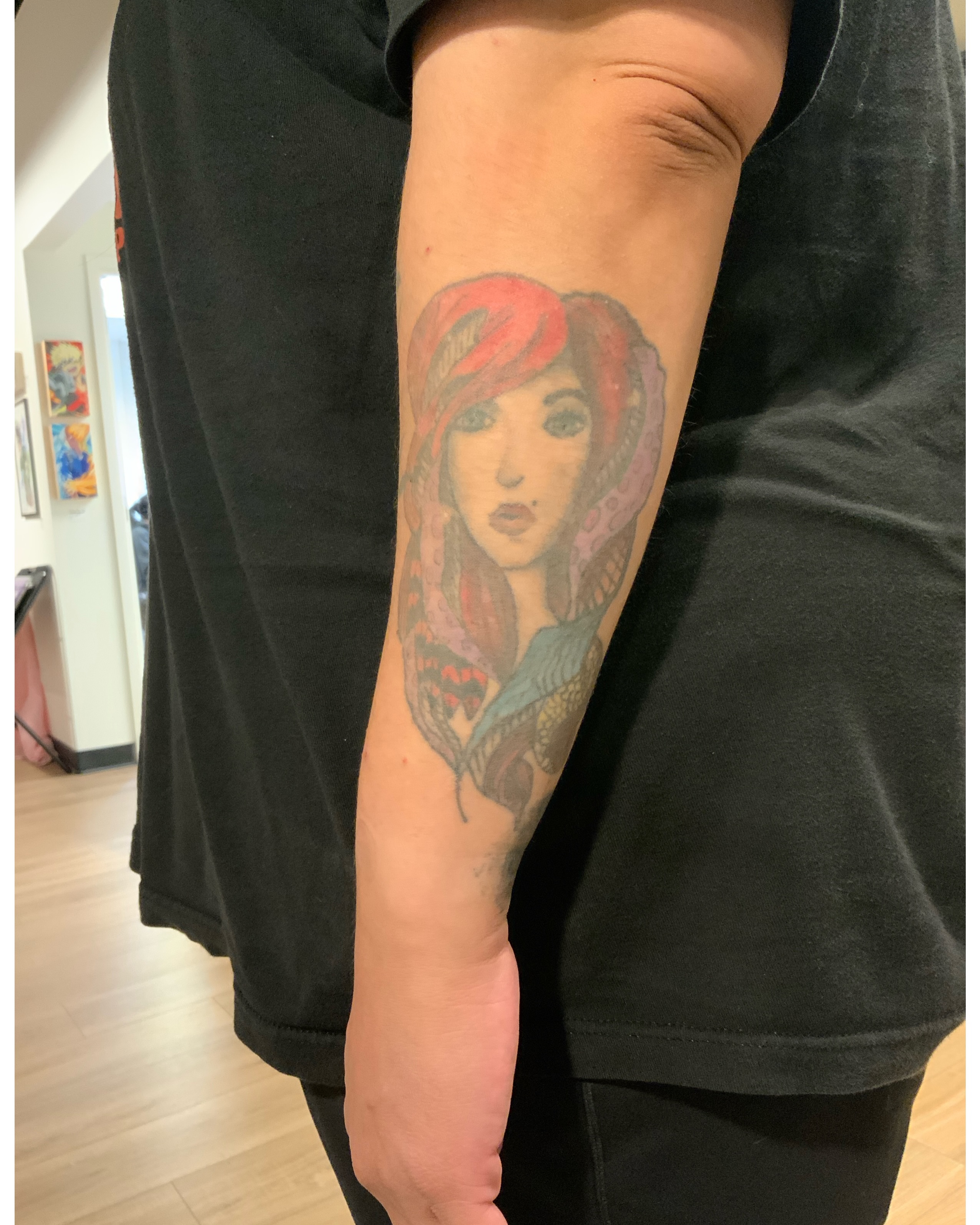 Woman with red hair realism tattoo on the forearm by Paisley Diaz, Lombard, Illinois