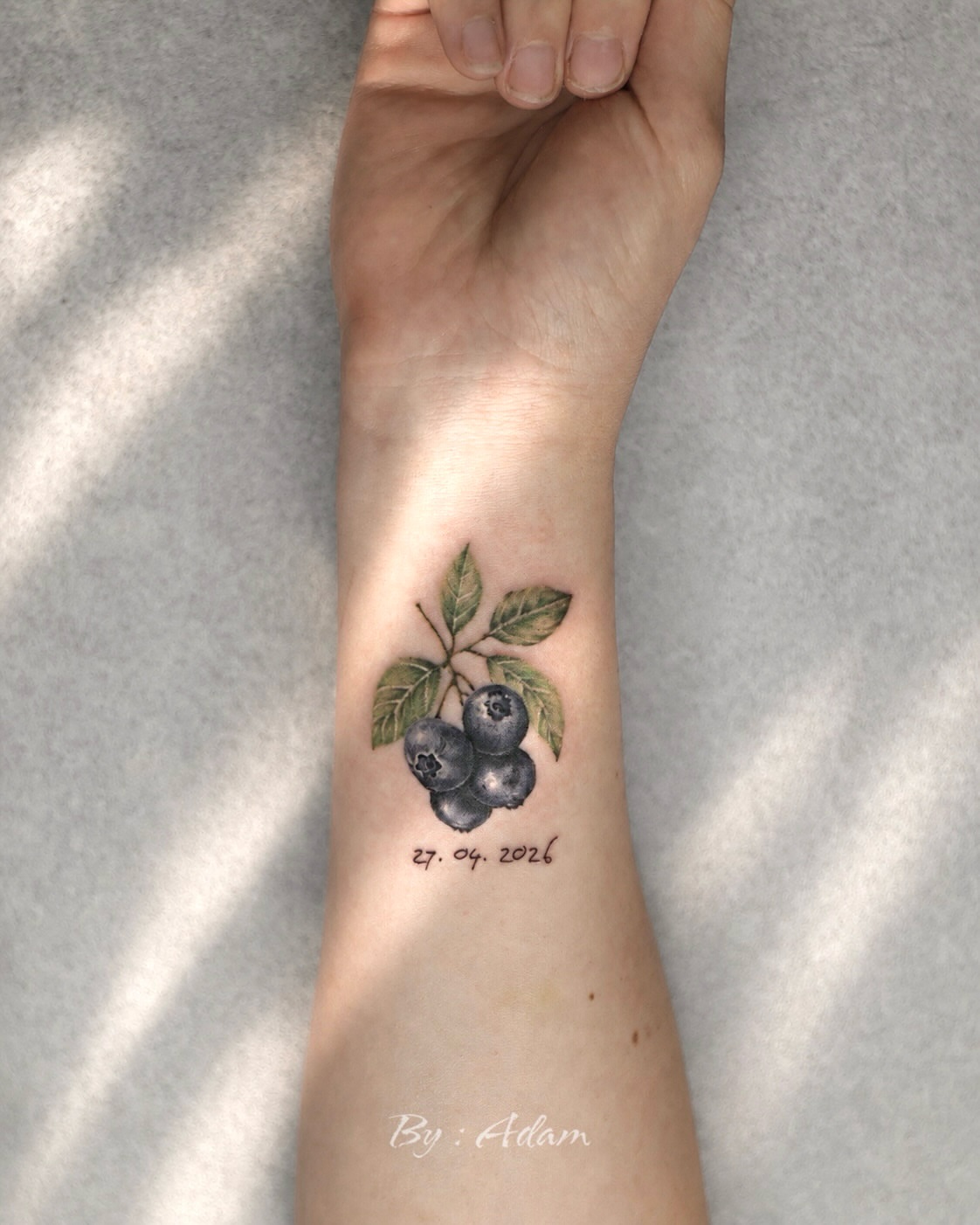 Blueberries realism tattoo on the forearm by Adam_Zhiwei Xu(Tattooist)