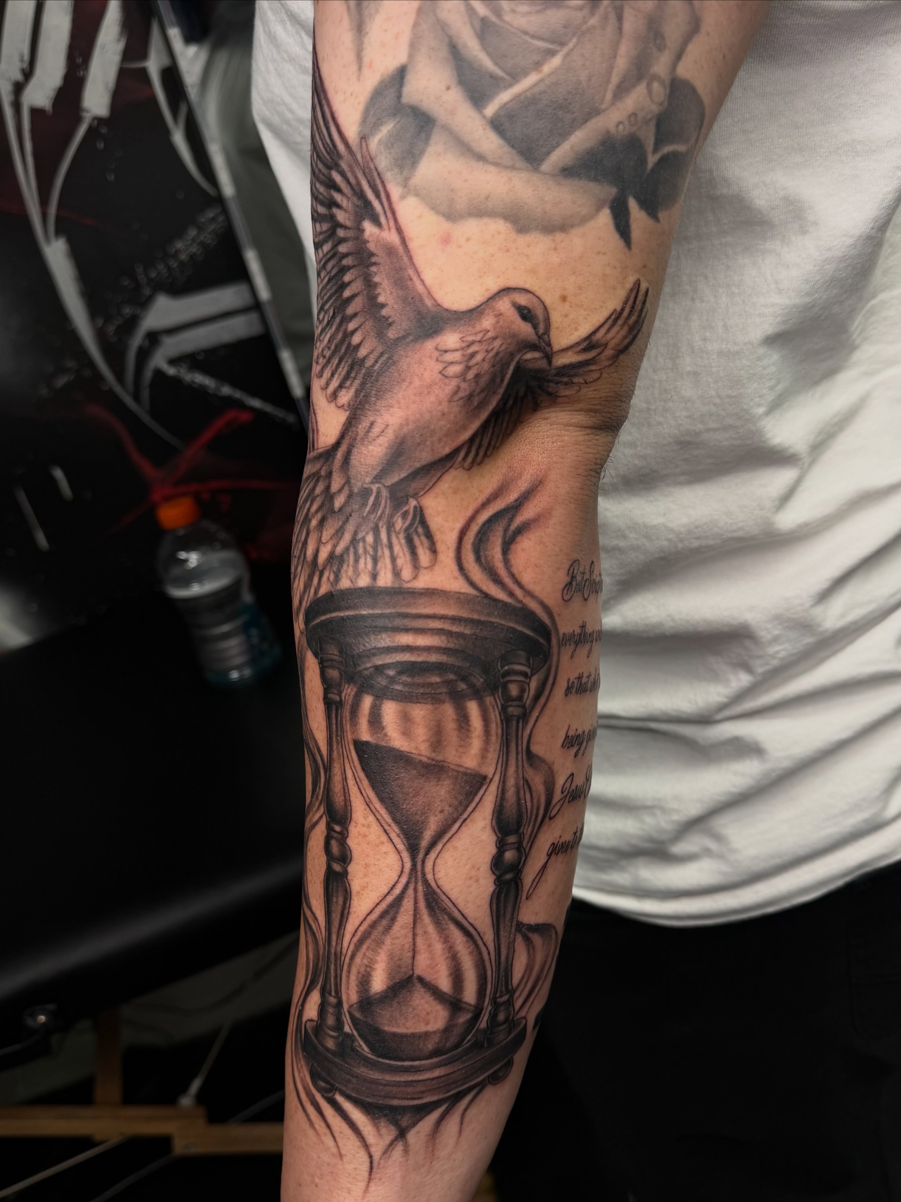 Hourglass and dove realism tattoo on the forearm by Kimberly landin