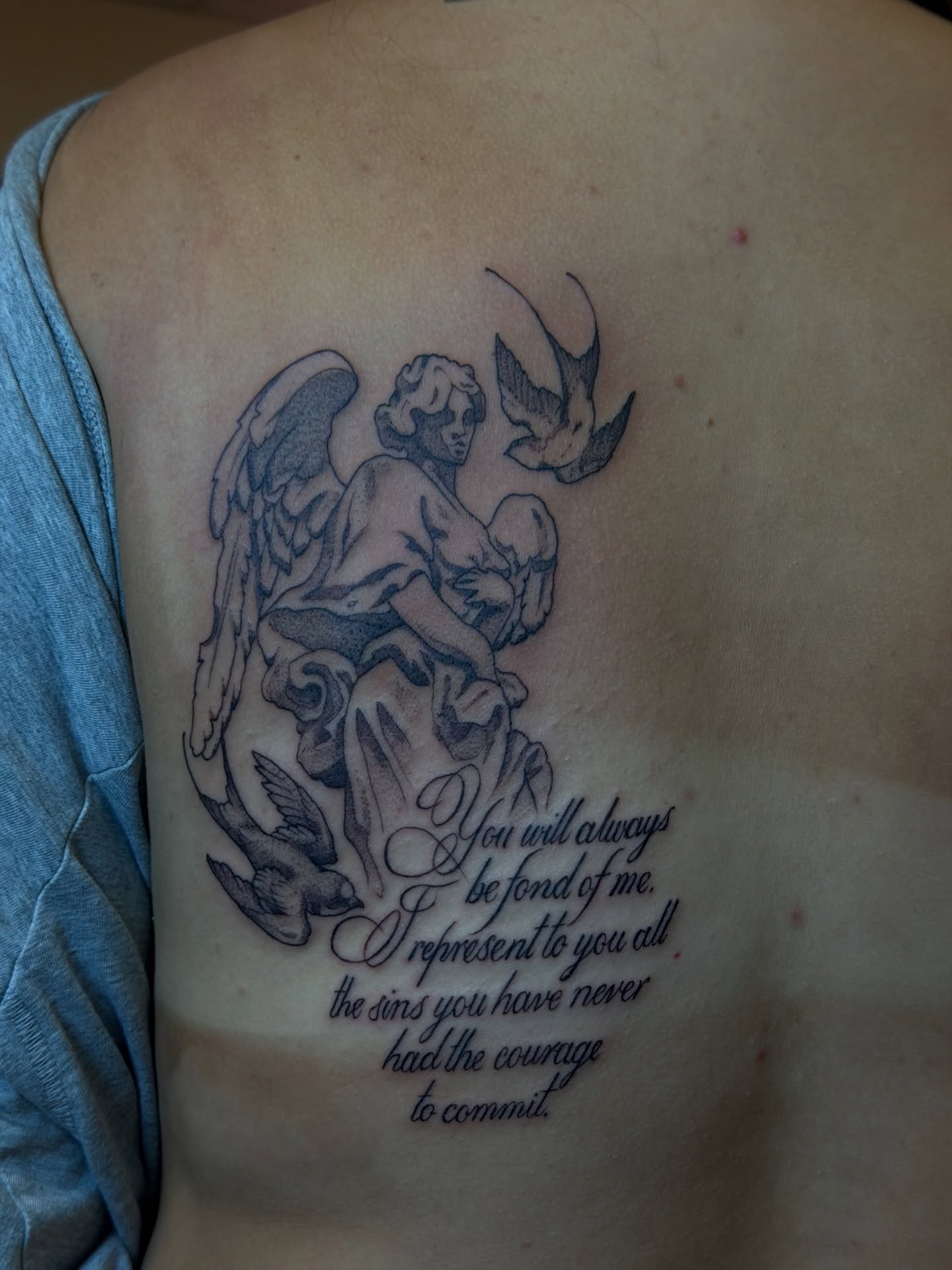 Angel and dove black and grey tattoo on the shoulder by Gianna Calisi