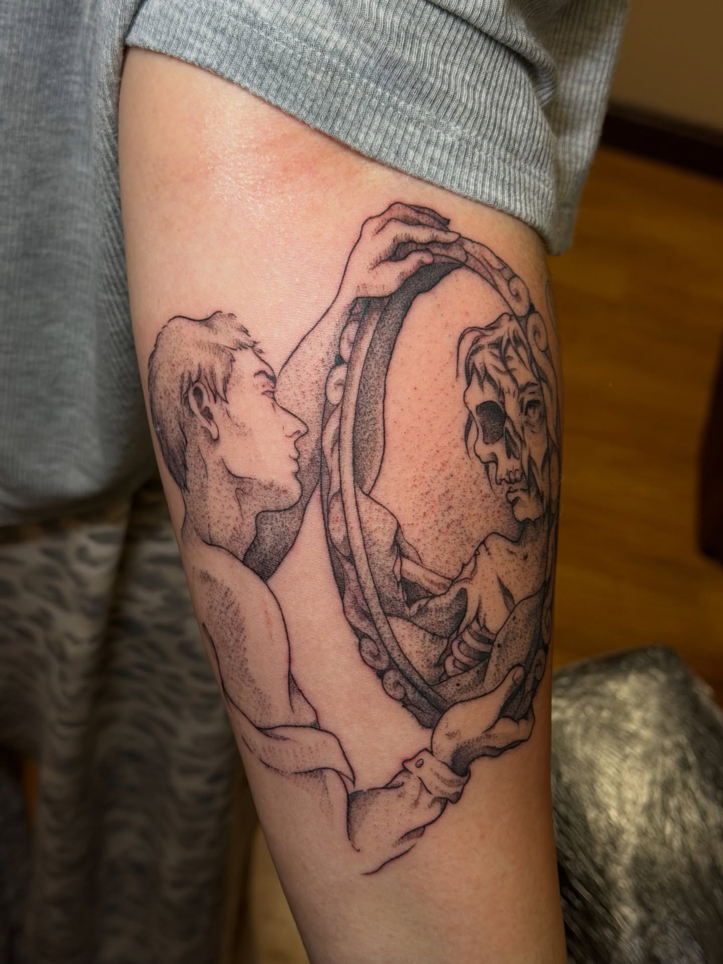 Mirror reflection dotwork tattoo on the forearm by Gianna Calisi