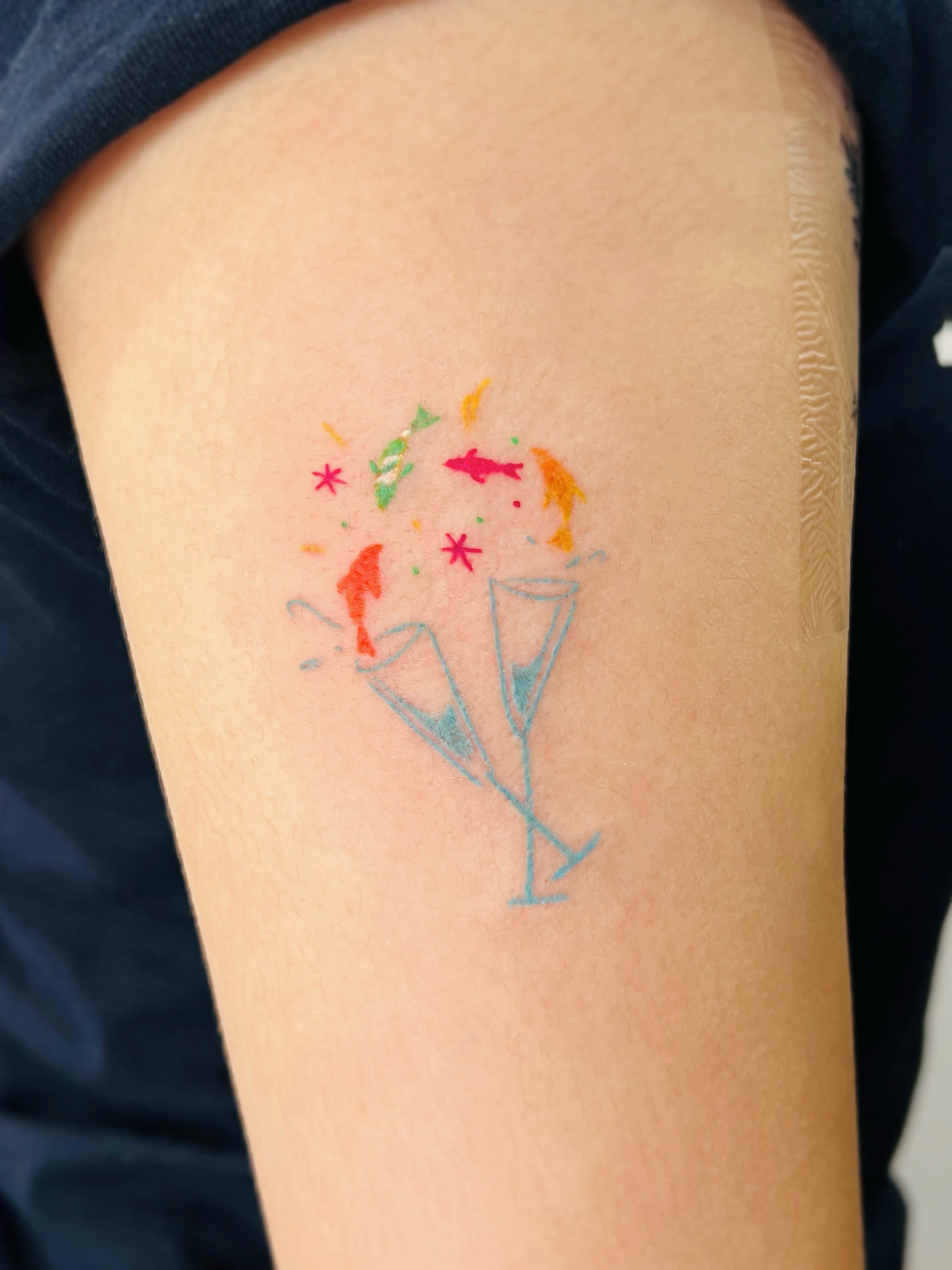 Martini glasses watercolor tattoo on the forearm by Purinn