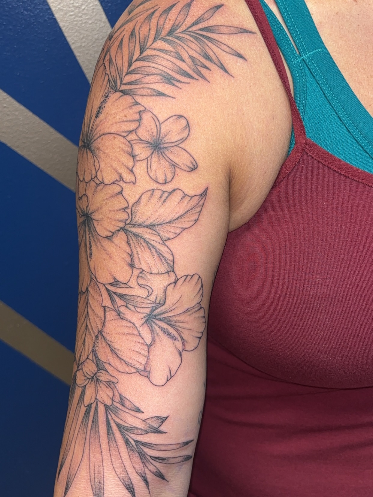 Floral arrangement black and grey tattoo on the upper arm by ✨Cyerra Lynne✨
