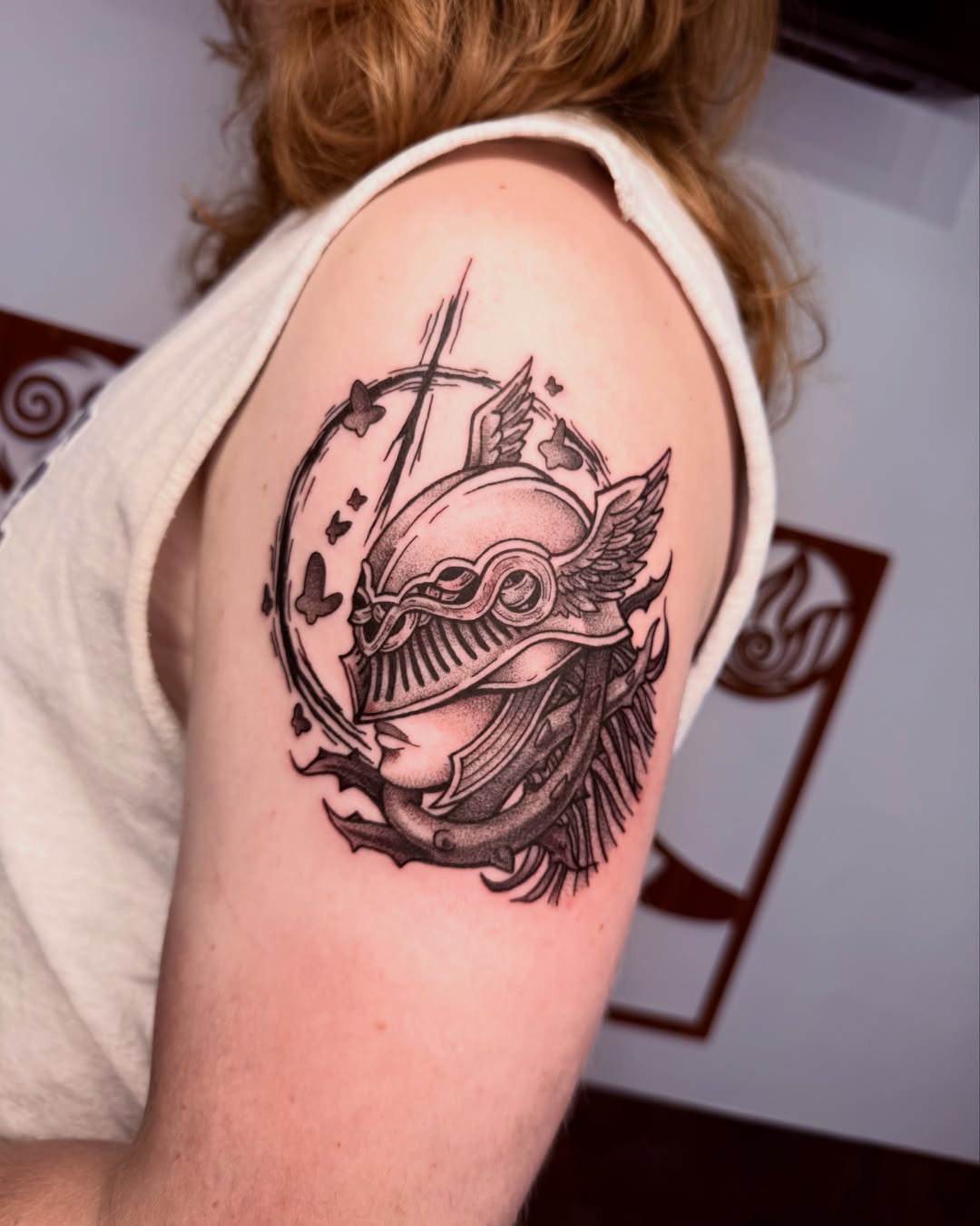 Helmet and snake realism tattoo on the shoulder by Jezza Munson