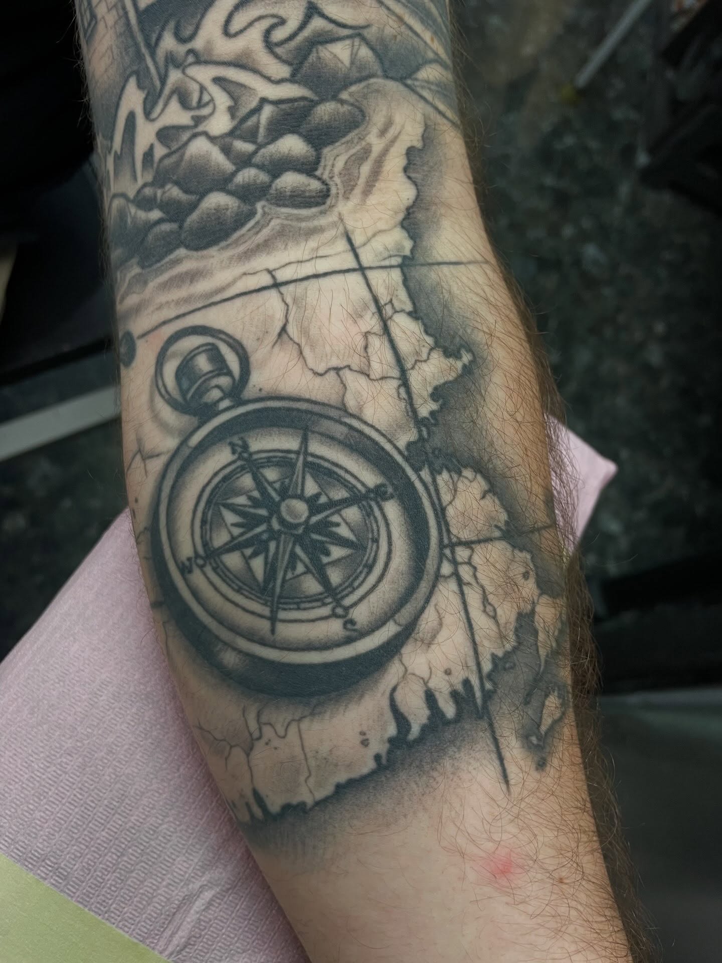 Compass realism tattoo on the forearm by Gerald Bellmore