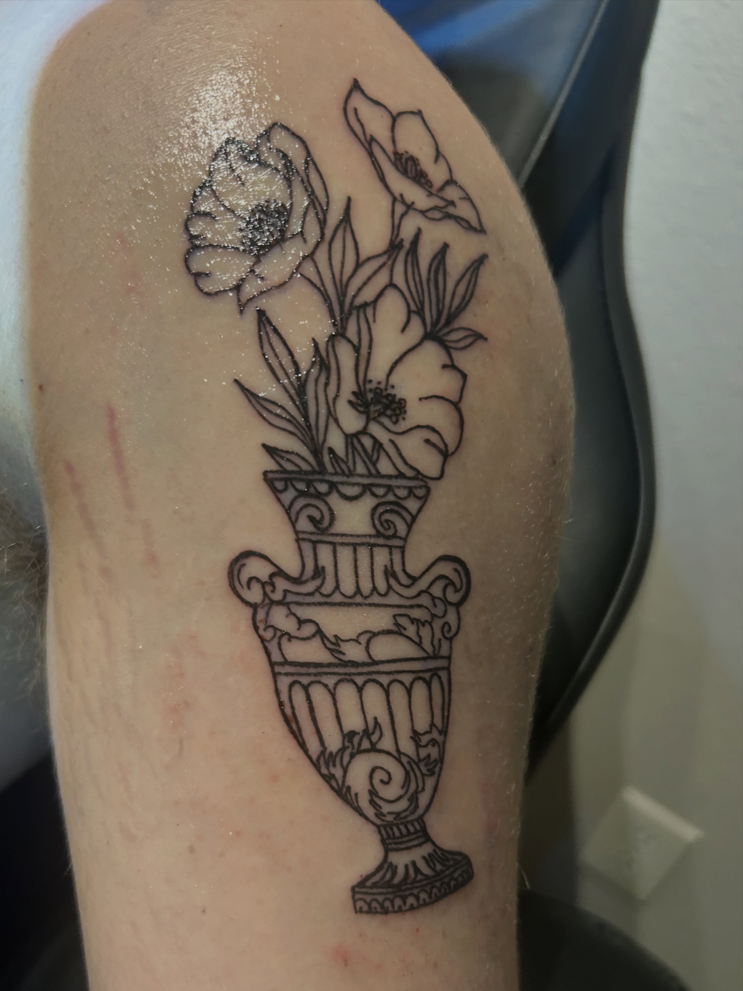 Flowers in vase black and grey tattoo on the forearm by @tatzbythadon