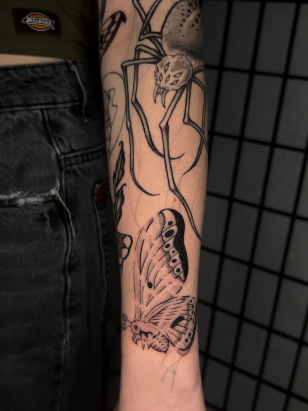 Butterfly black and grey tattoo on the forearm by Vic Merkley
