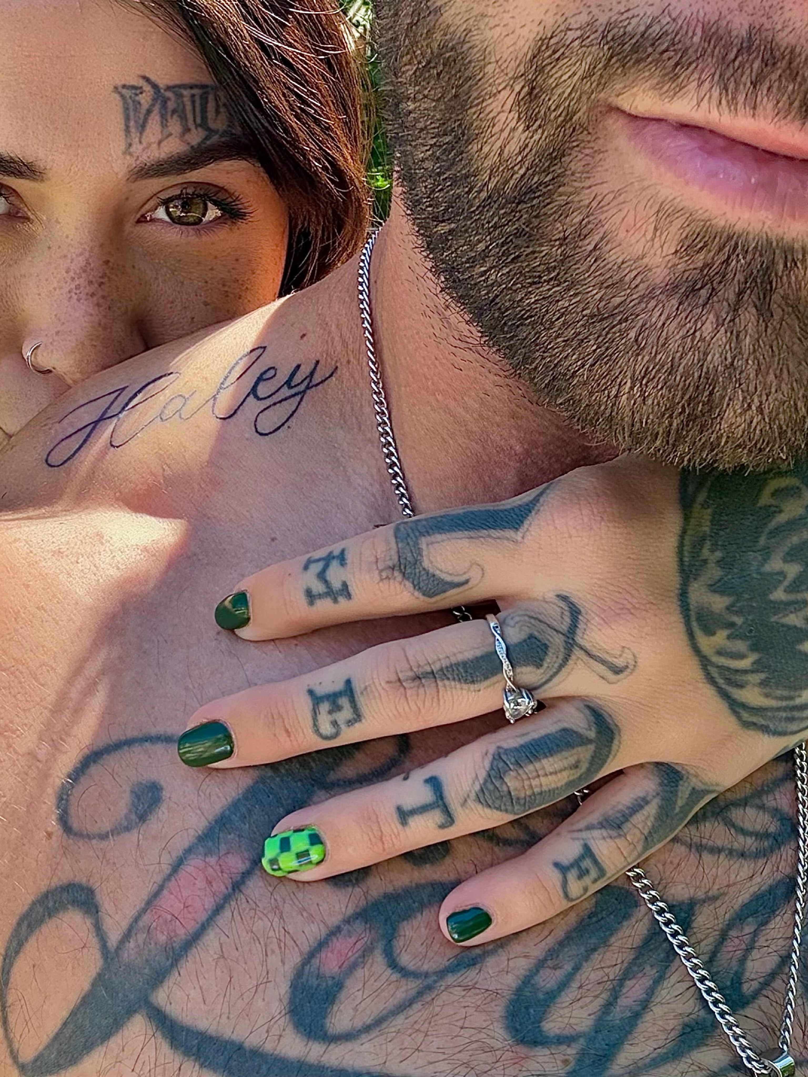 Name lettering script tattoo on the chest by Haley Bates