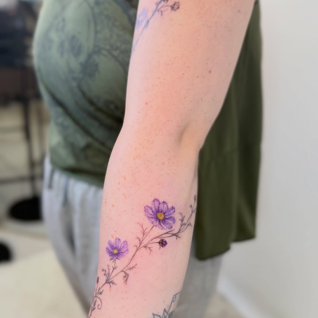 Purple flowers dotwork tattoo on the forearm by Yuri Chloe Ngo Tattoo Artist