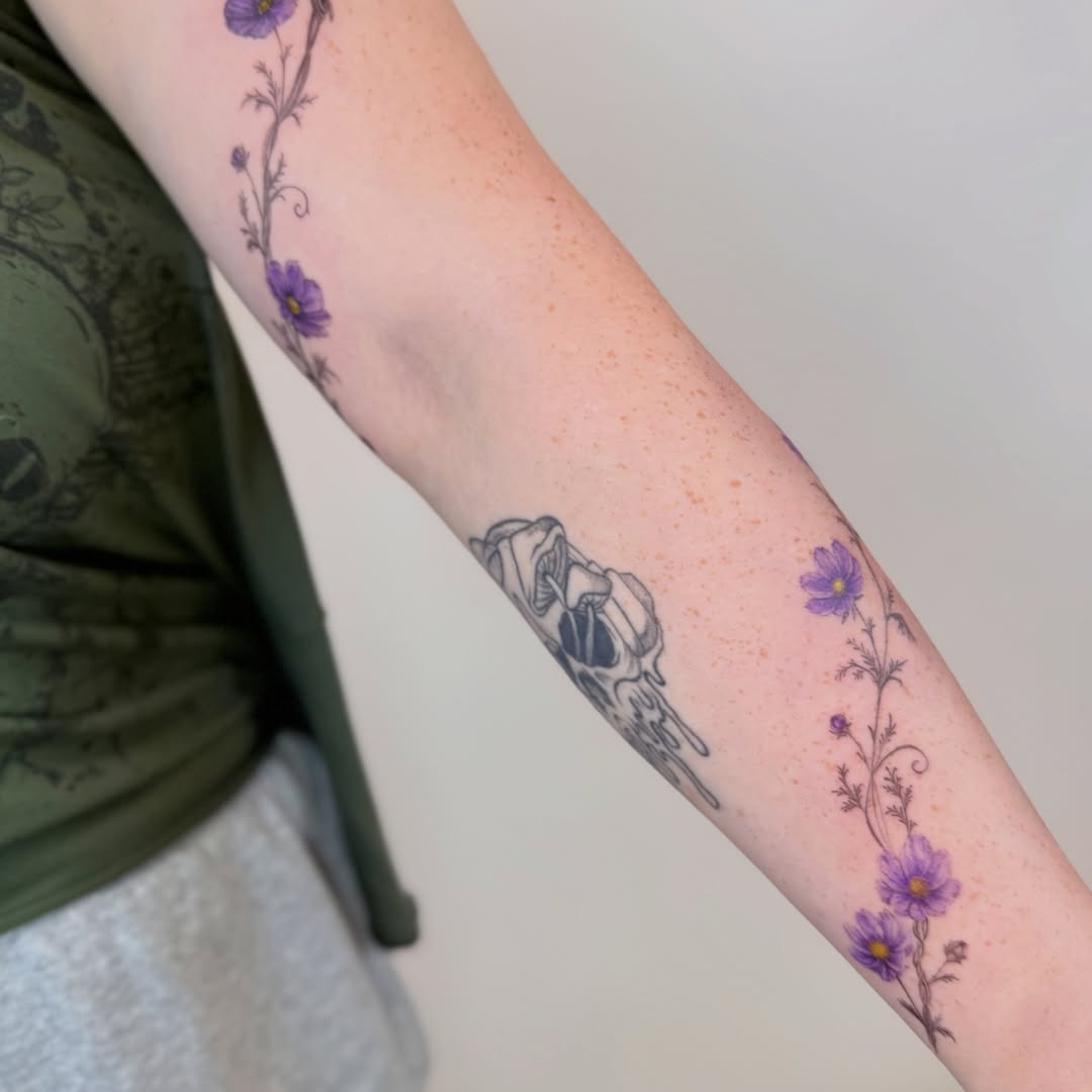Purple flowers and skull dotwork tattoo on the forearm by Yuri Chloe Ngo Tattoo Artist