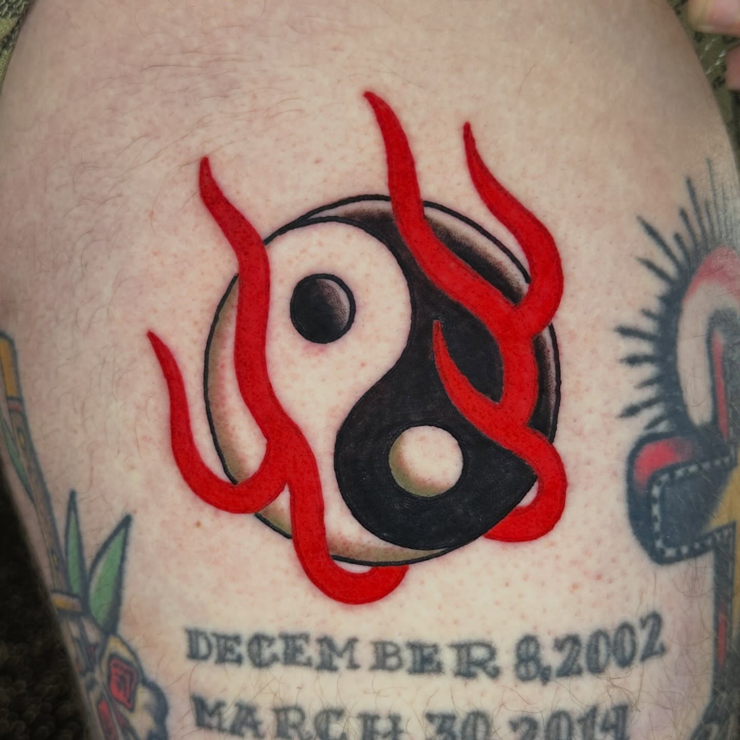 Yin-yang symbol geometric tattoo on the thigh by Kyle Logan Frary