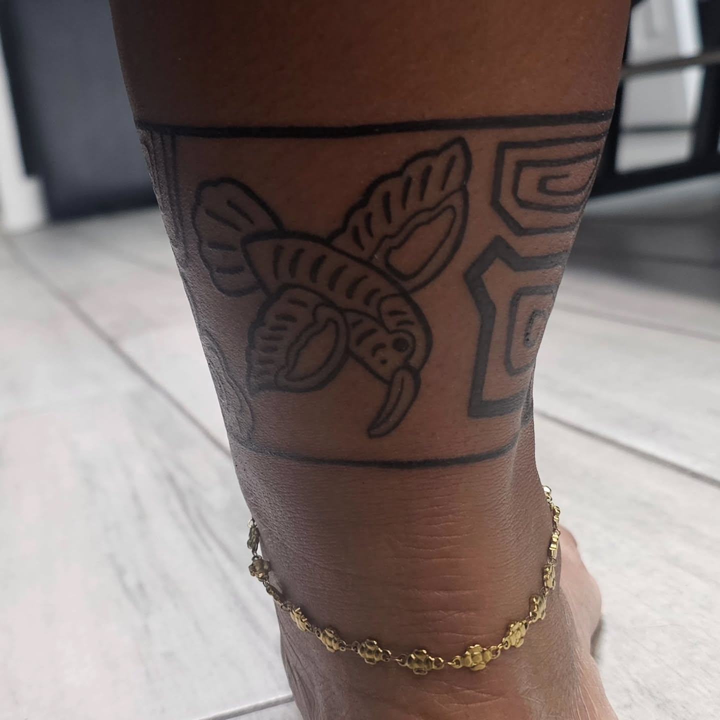 Lobster black and grey tattoo on the leg by Casey Jo