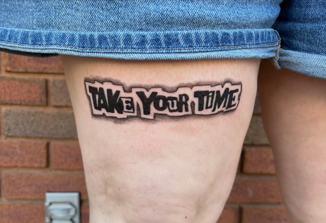 Take your time lettering script tattoo on the thigh by Sierra Maynard