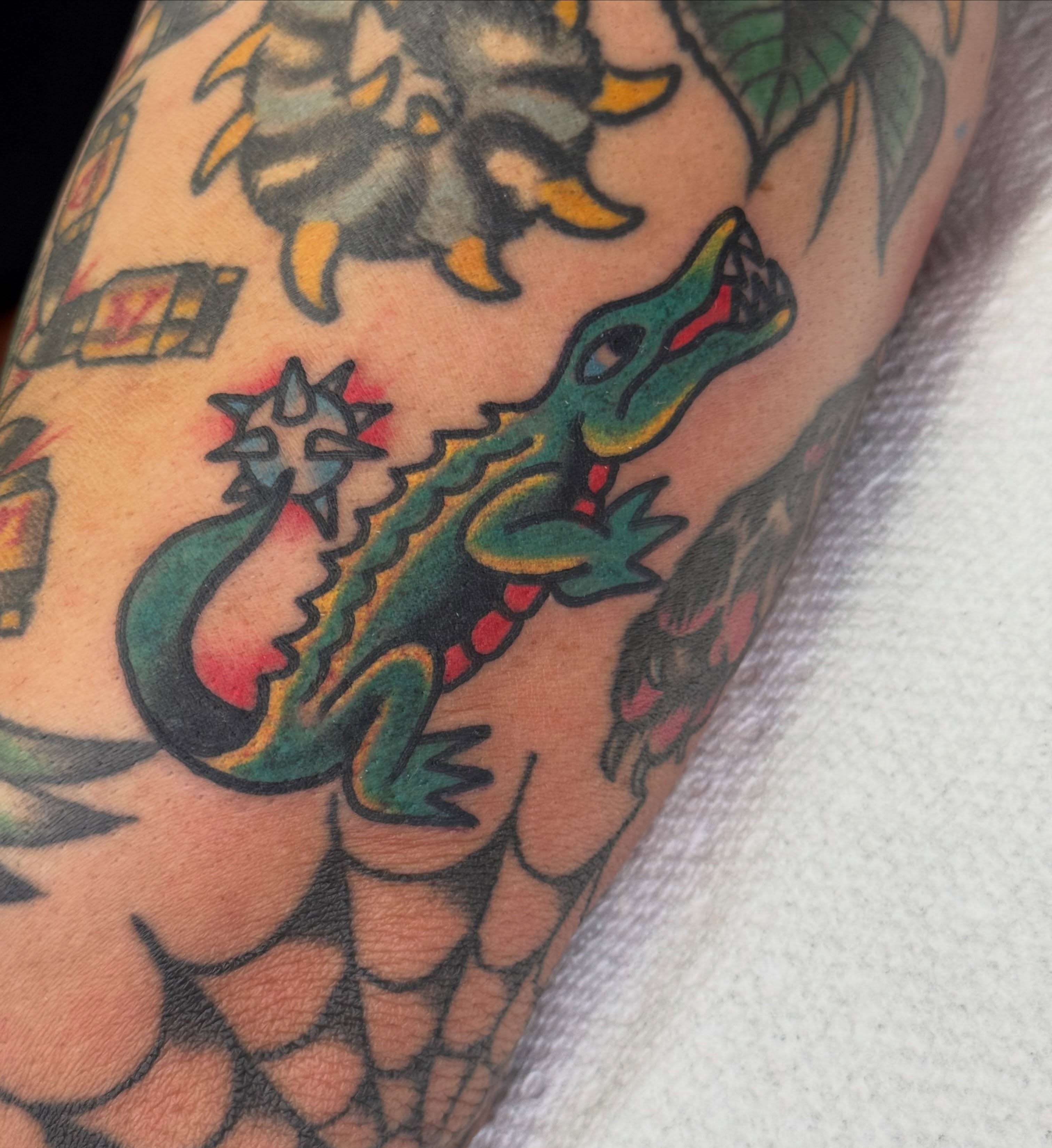 Alligator American traditional tattoo on the forearm by Kenny Kastro