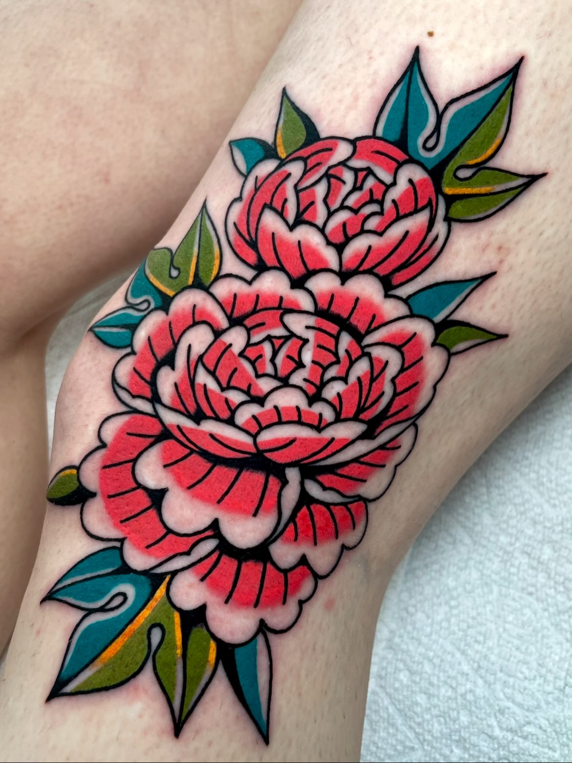 Peony American traditional tattoo on the forearm by Ryan McDonald