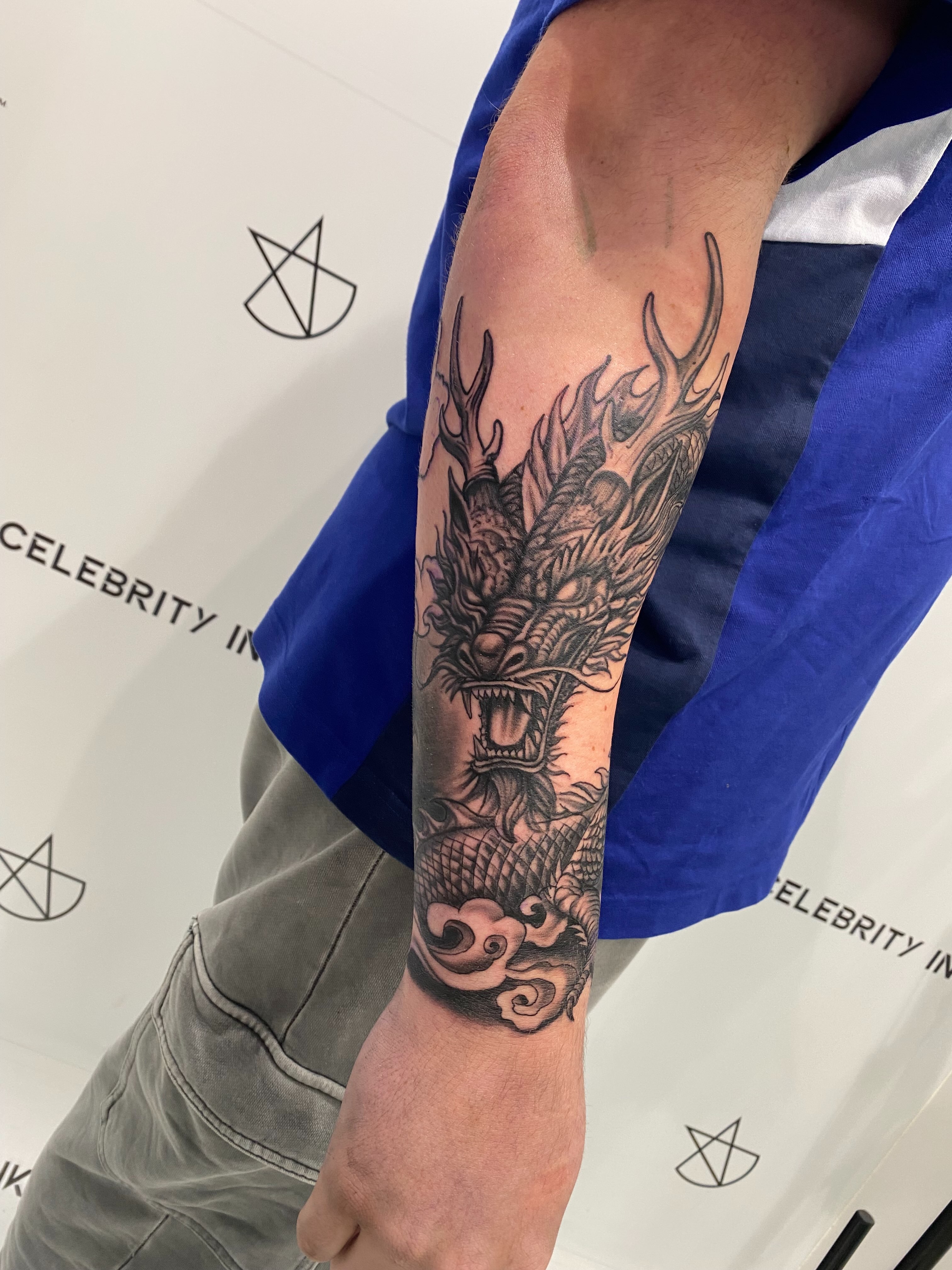 Dragon black and grey tattoo on the forearm by @dom_macio_tattoo
