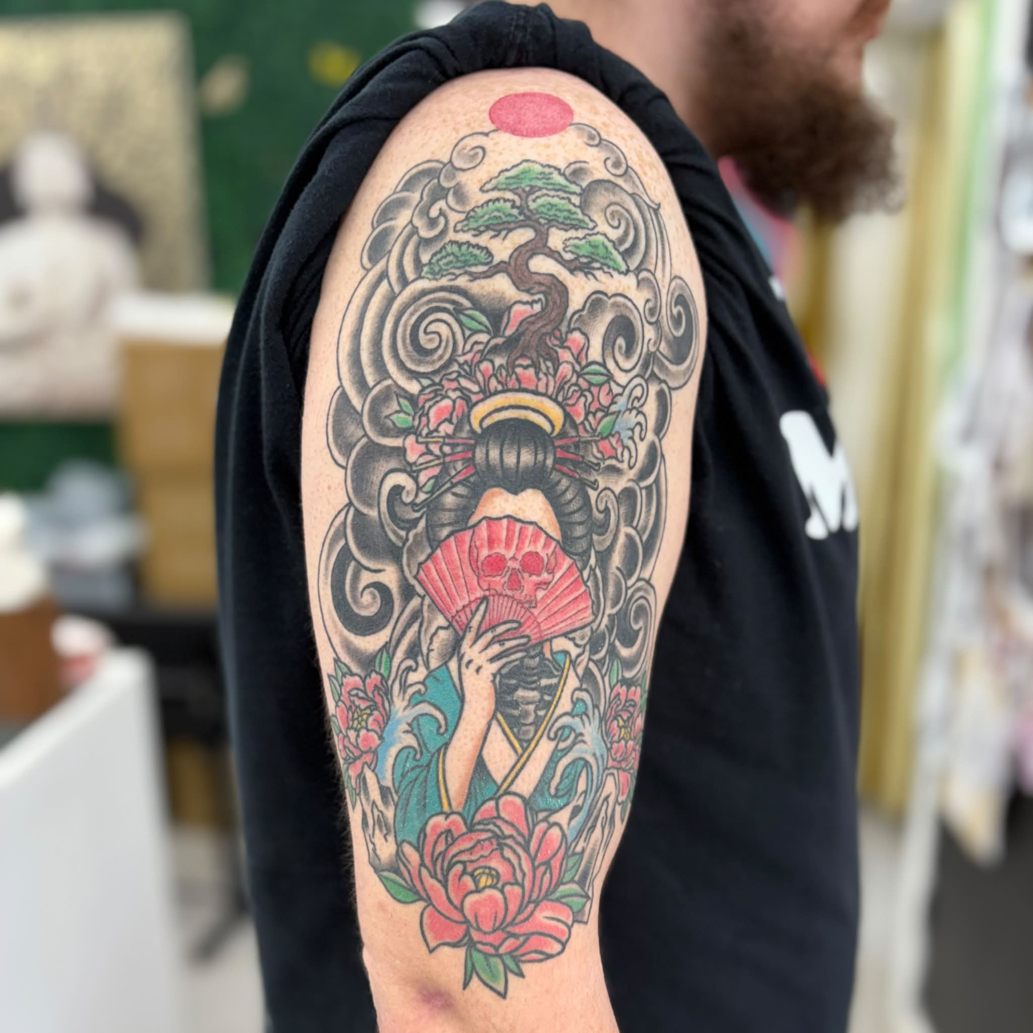Geisha with fan japanese irezumi tattoo on the upper arm by Jon Anderson
