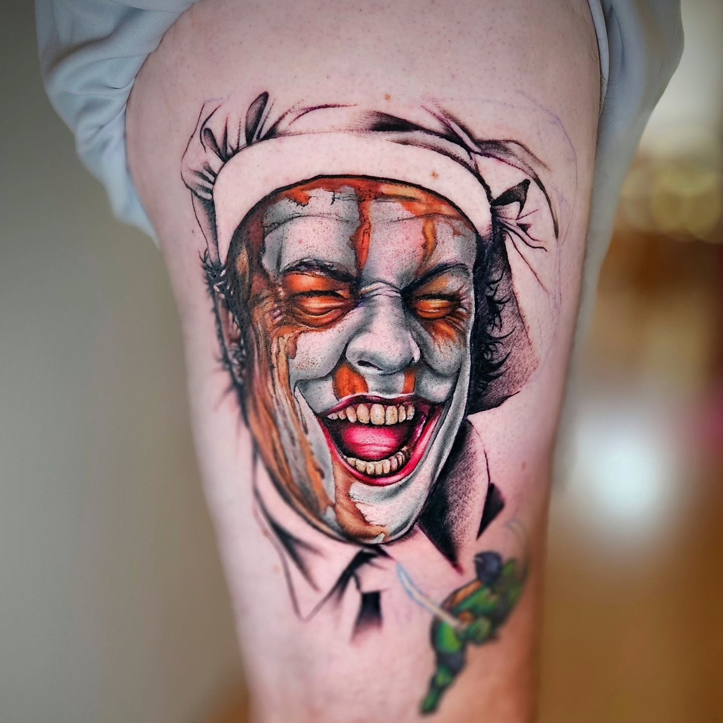 Clown realism tattoo on the thigh by Justin J-rust Smith