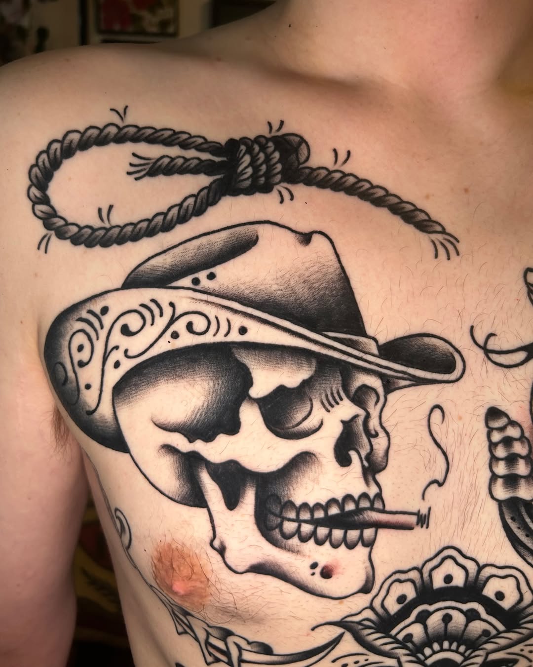Cowboy skull with noose realism tattoo on the chest by Olivia Marie