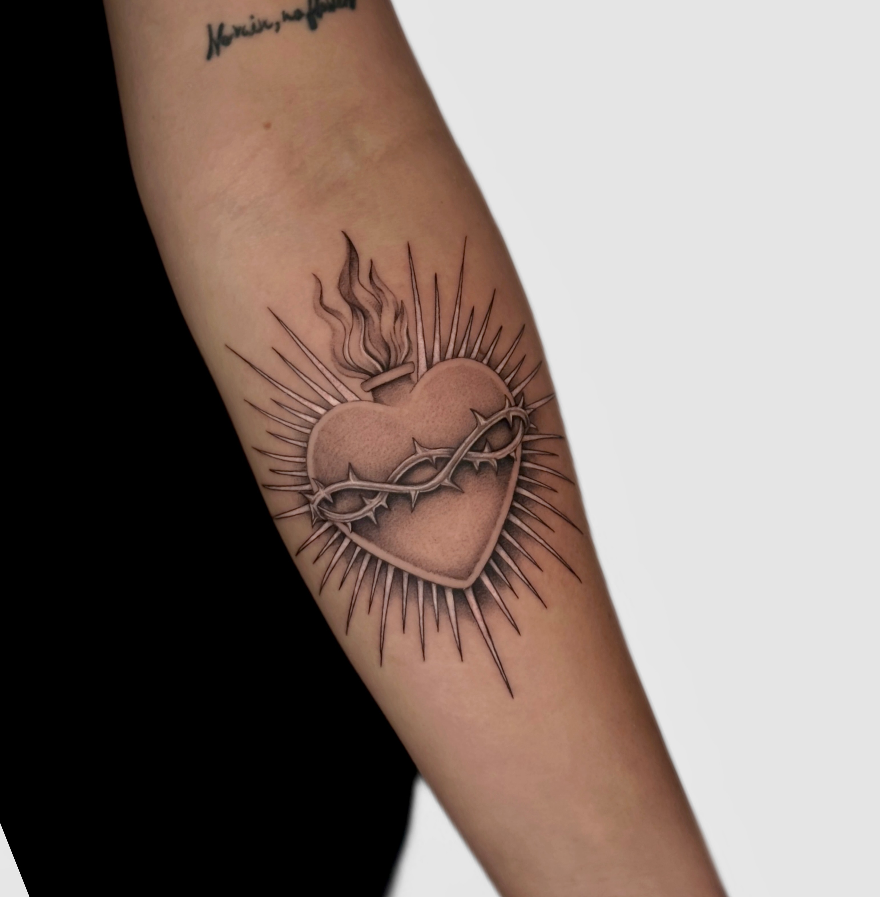 Heart with thorns black and grey tattoo on the forearm by Miami Tattoo Artist, Miami, Florida