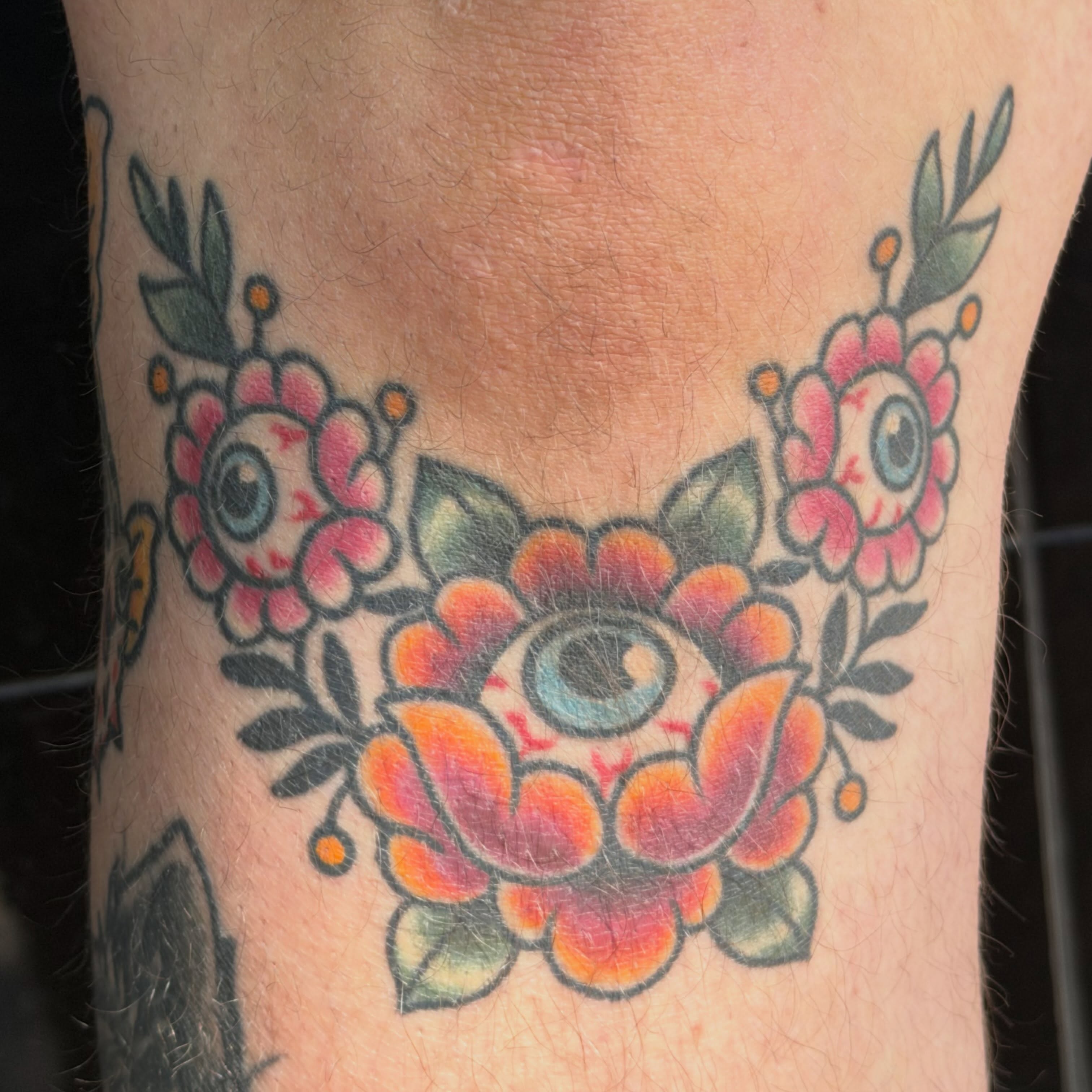 Floral necklace American traditional tattoo on the forearm by Beeker, Bellingham, Washington