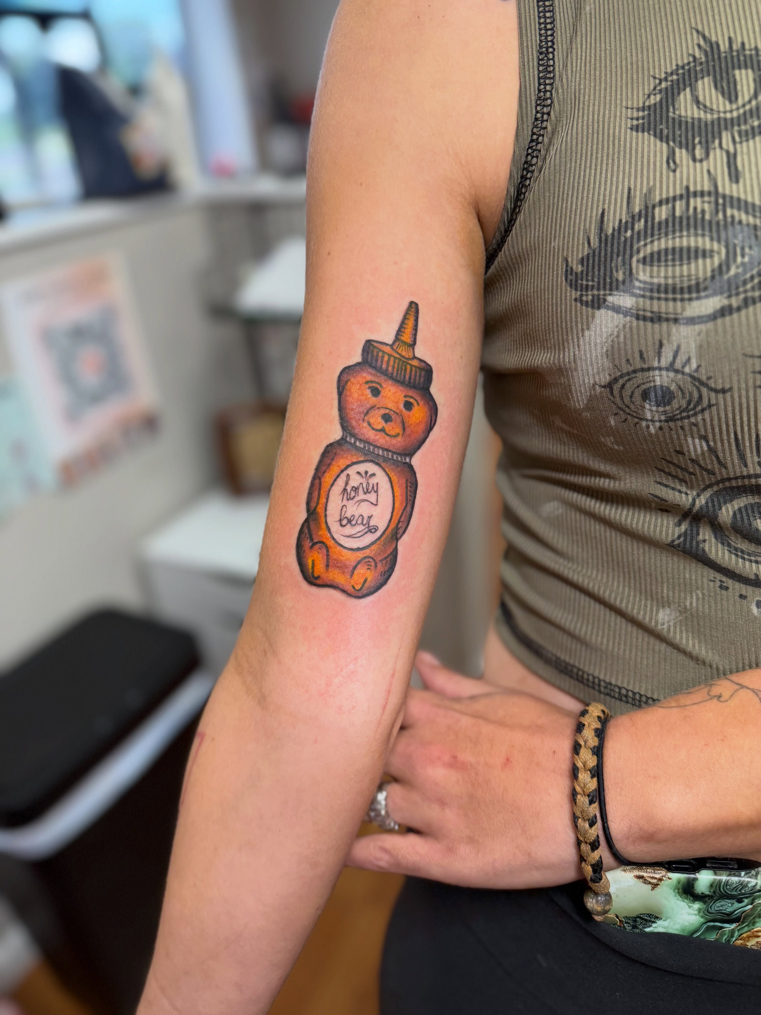 Teddy bear honey jar new school tattoo on the forearm by Skylar Sheeley