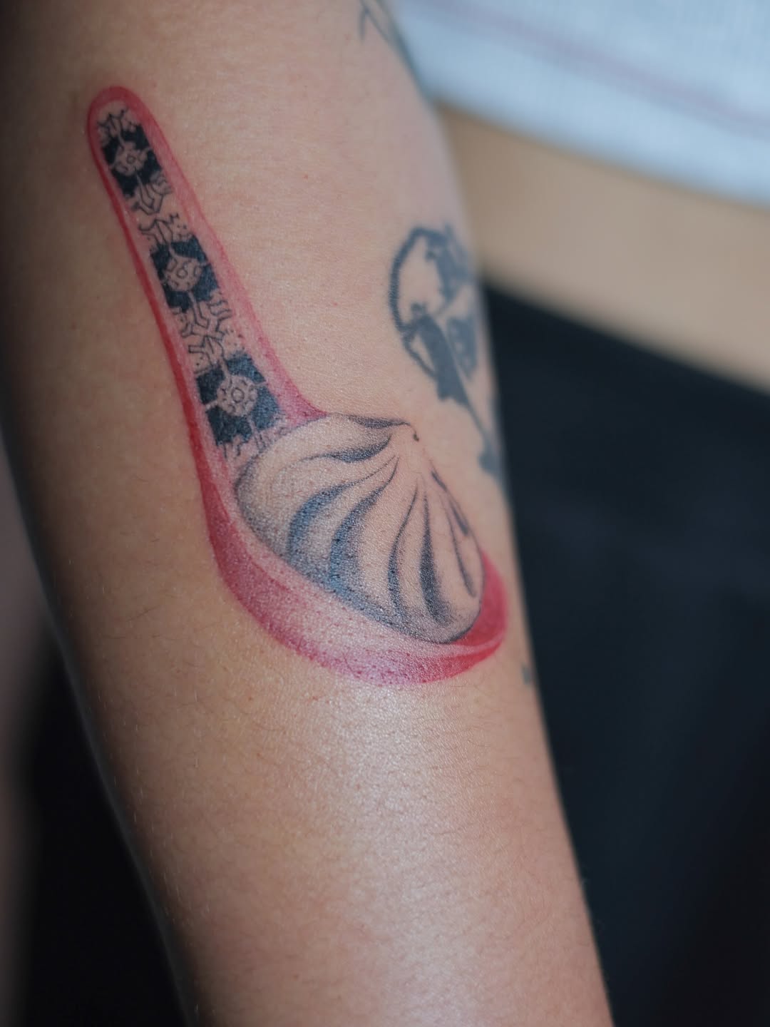 Dumpling on a spoon tattoo on the forearm by Jinz