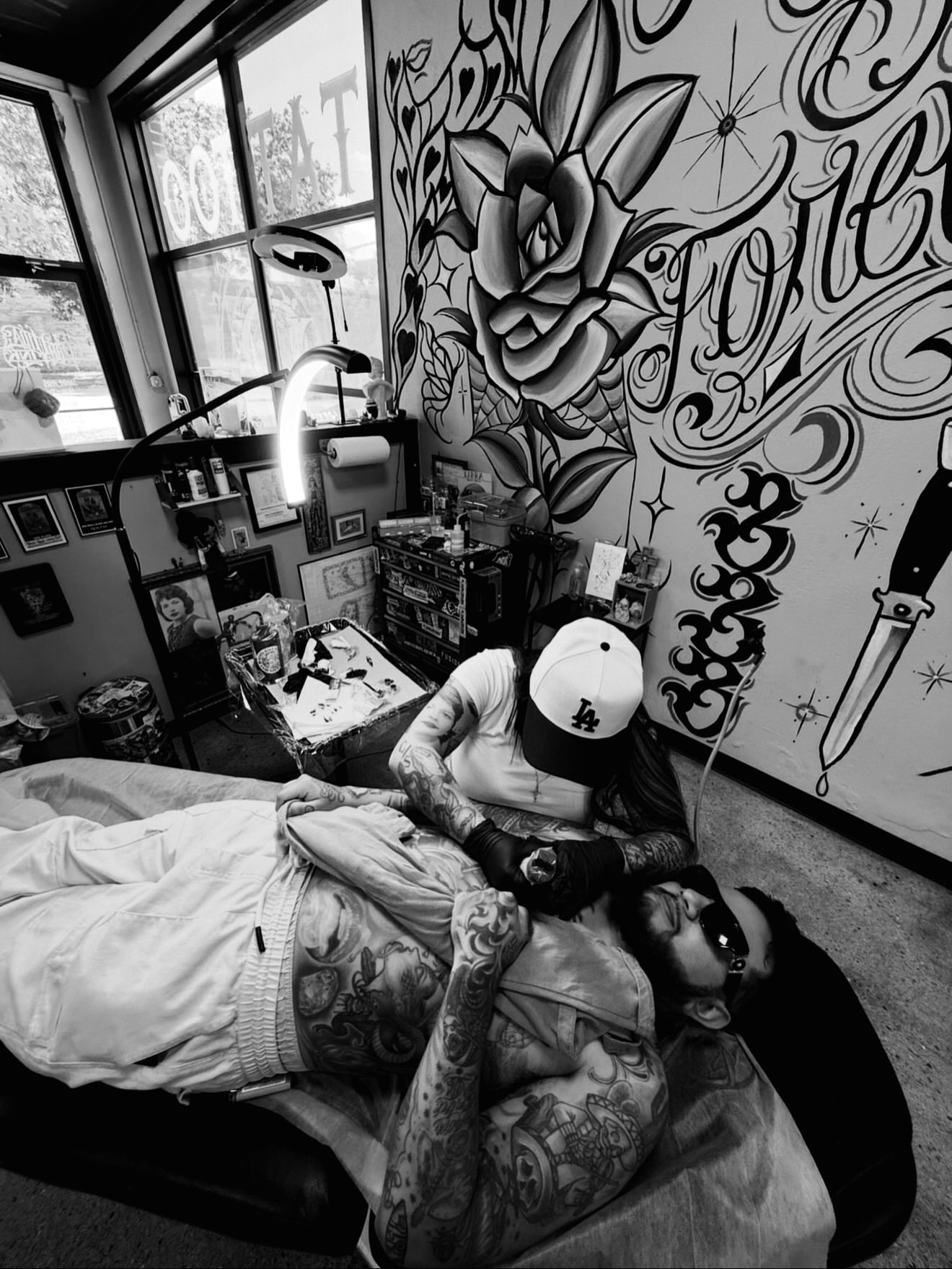 Tattoo artist and client black and grey tattoo on the torso by Giana Martinez, Wichita, Kansas