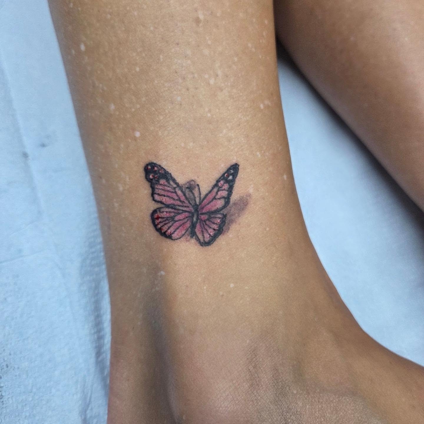 Butterfly dotwork tattoo on the foot by Matthew Todd Kremer