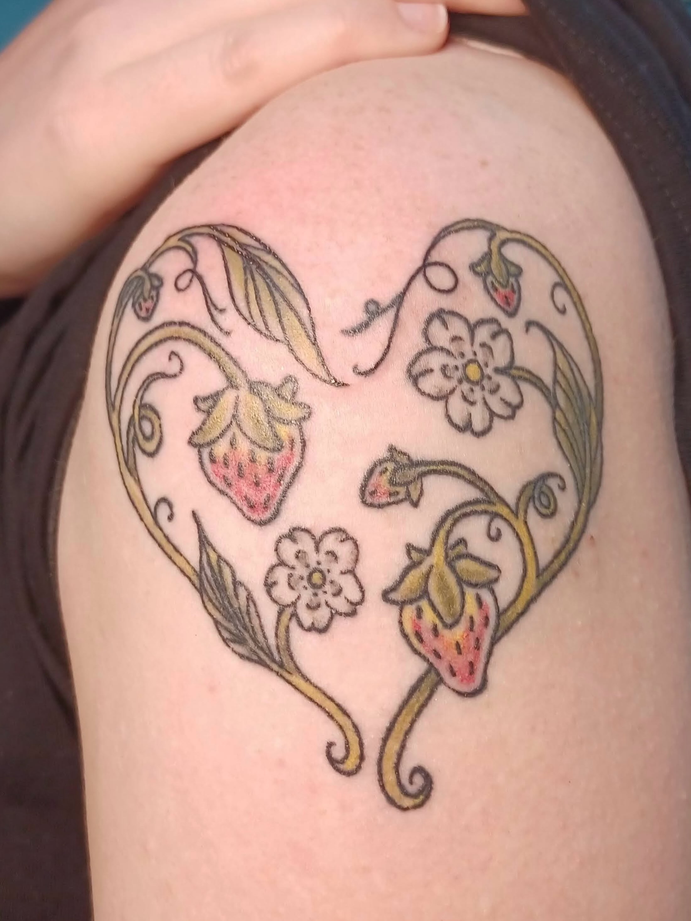 Heart with strawberries and flowers ornamental tattoo on the shoulder by Abi