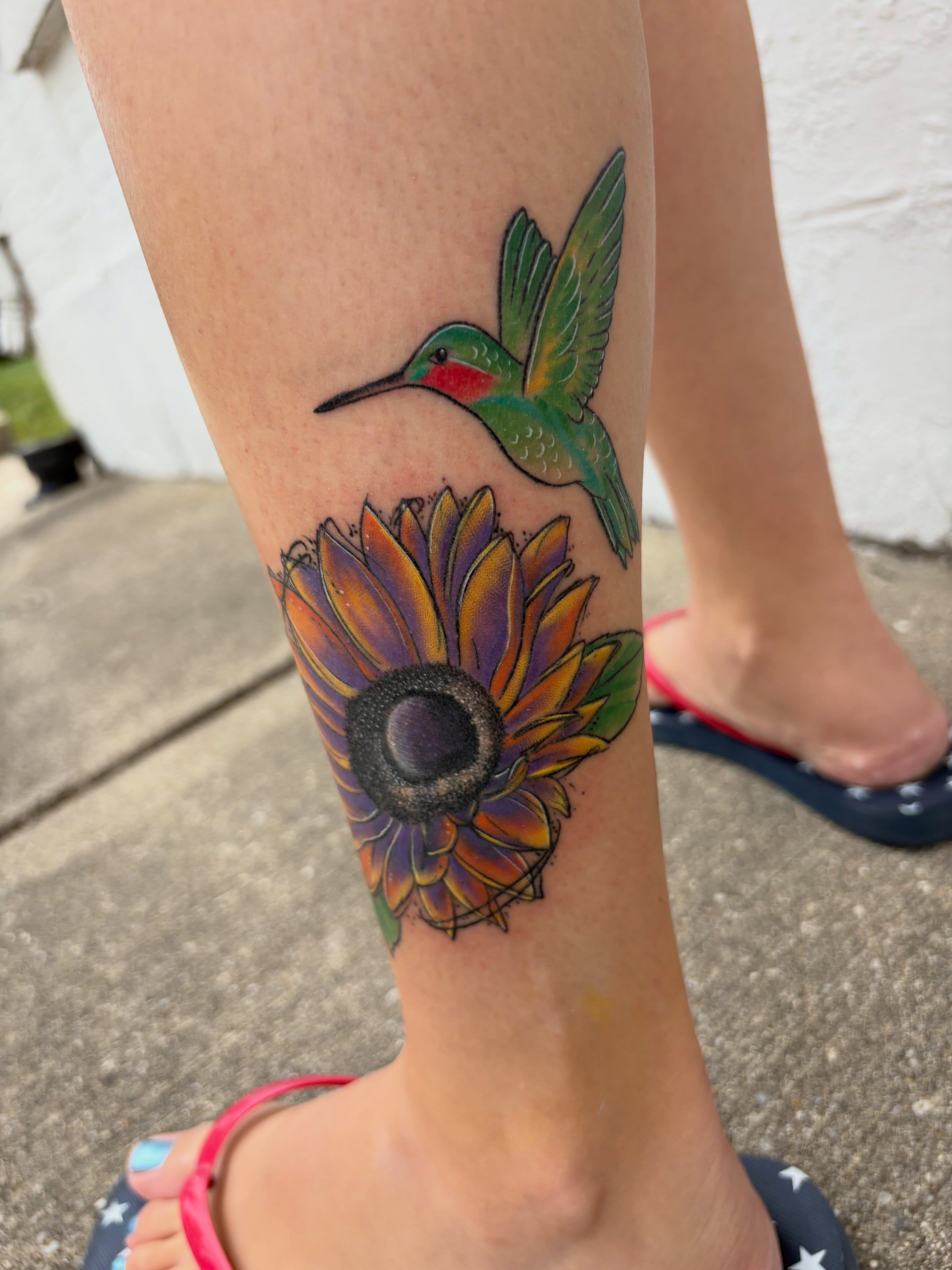 Hummingbird and sunflower new school tattoo on the forearm by Andrea 🎨🖌
