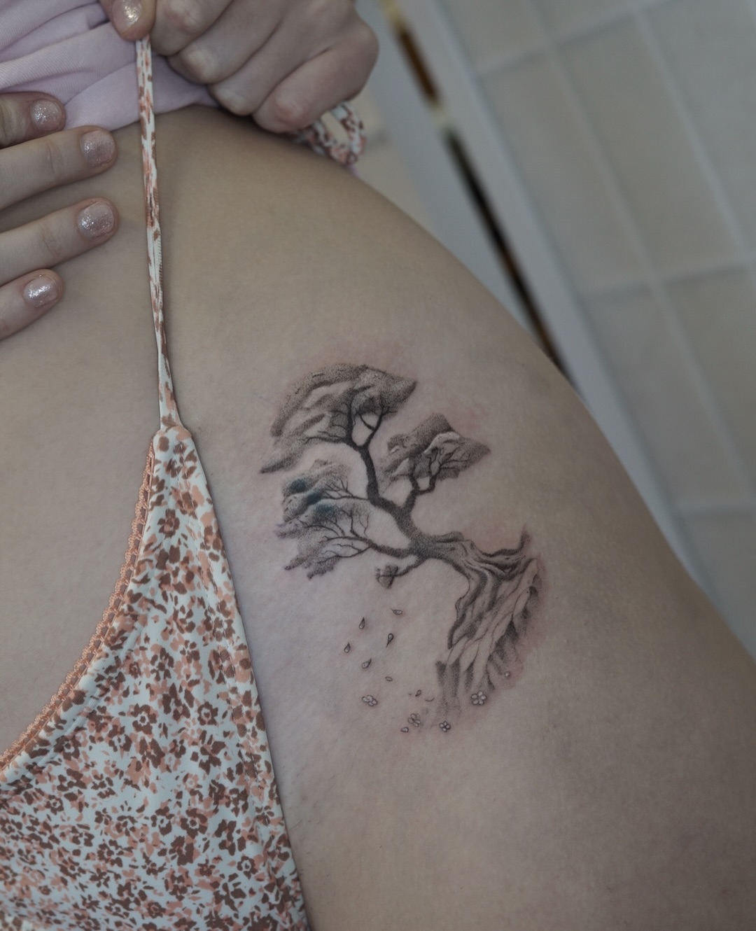 Tree black and grey tattoo on the thigh by Josh Infante